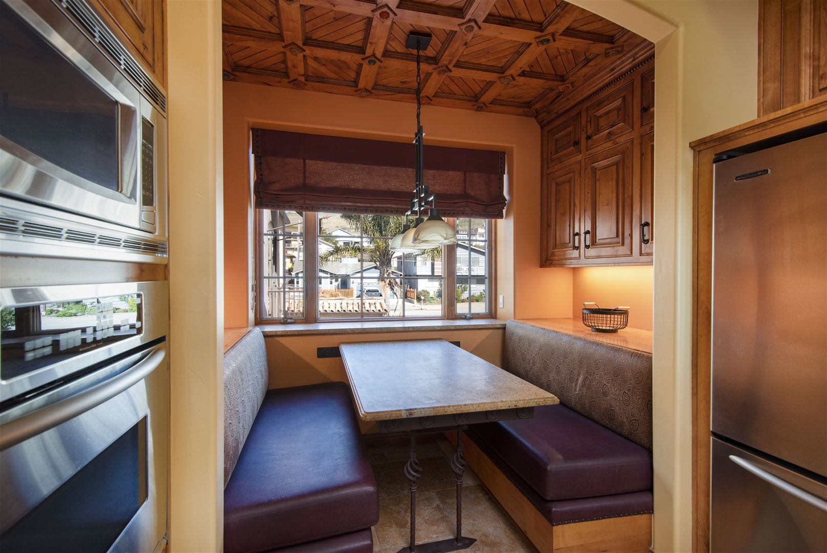 Breakfast nook in the kitchen, perfect space for additional dining. Has small TV for the kids too.