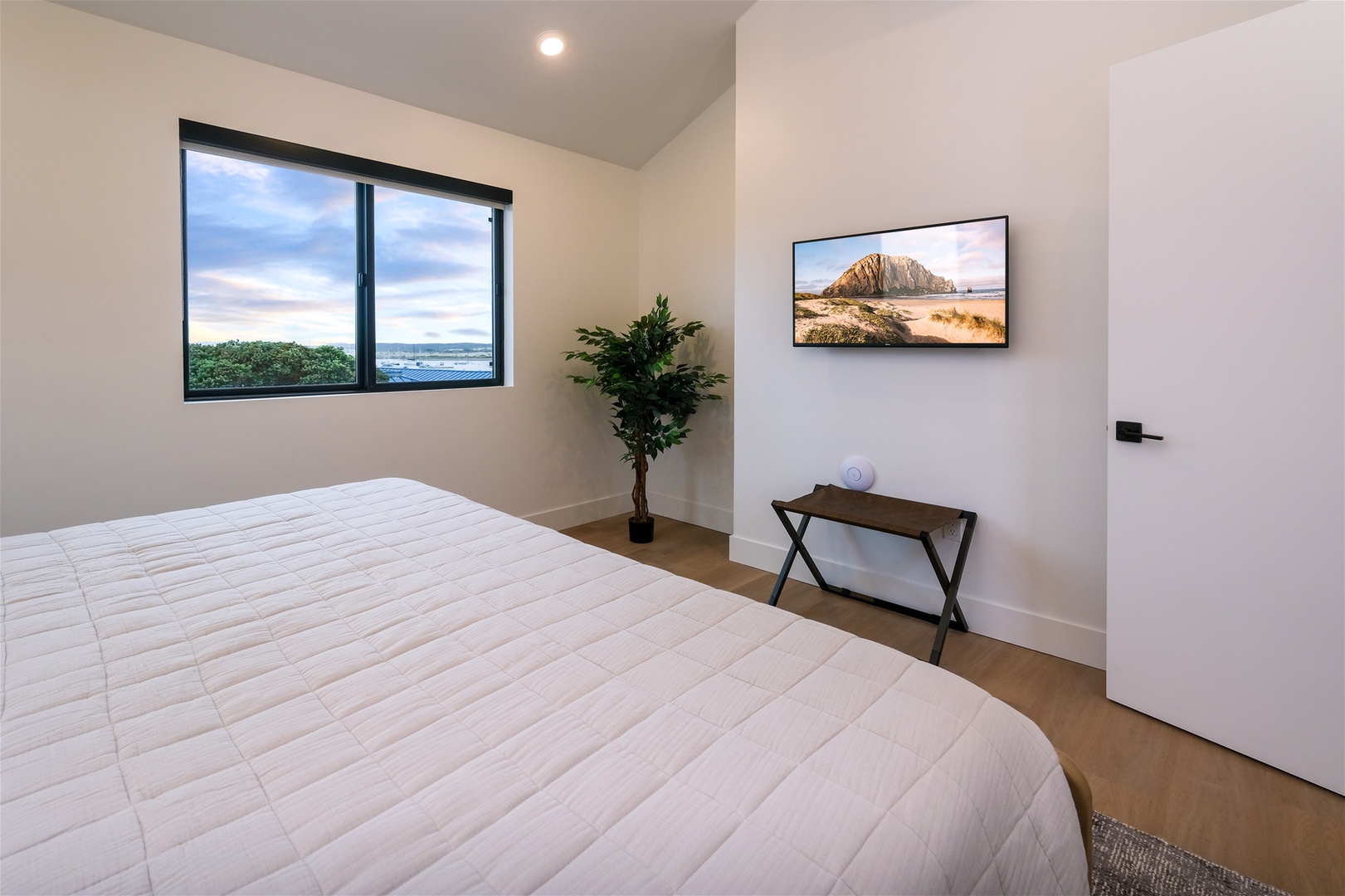 Bedroom also features a flat screen tv
