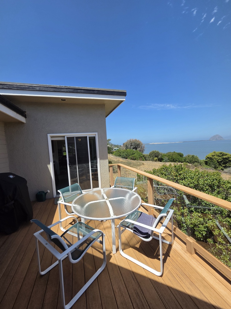The deck with BBQ grill and patio table, perfect for alfreco dining and watching the sunset