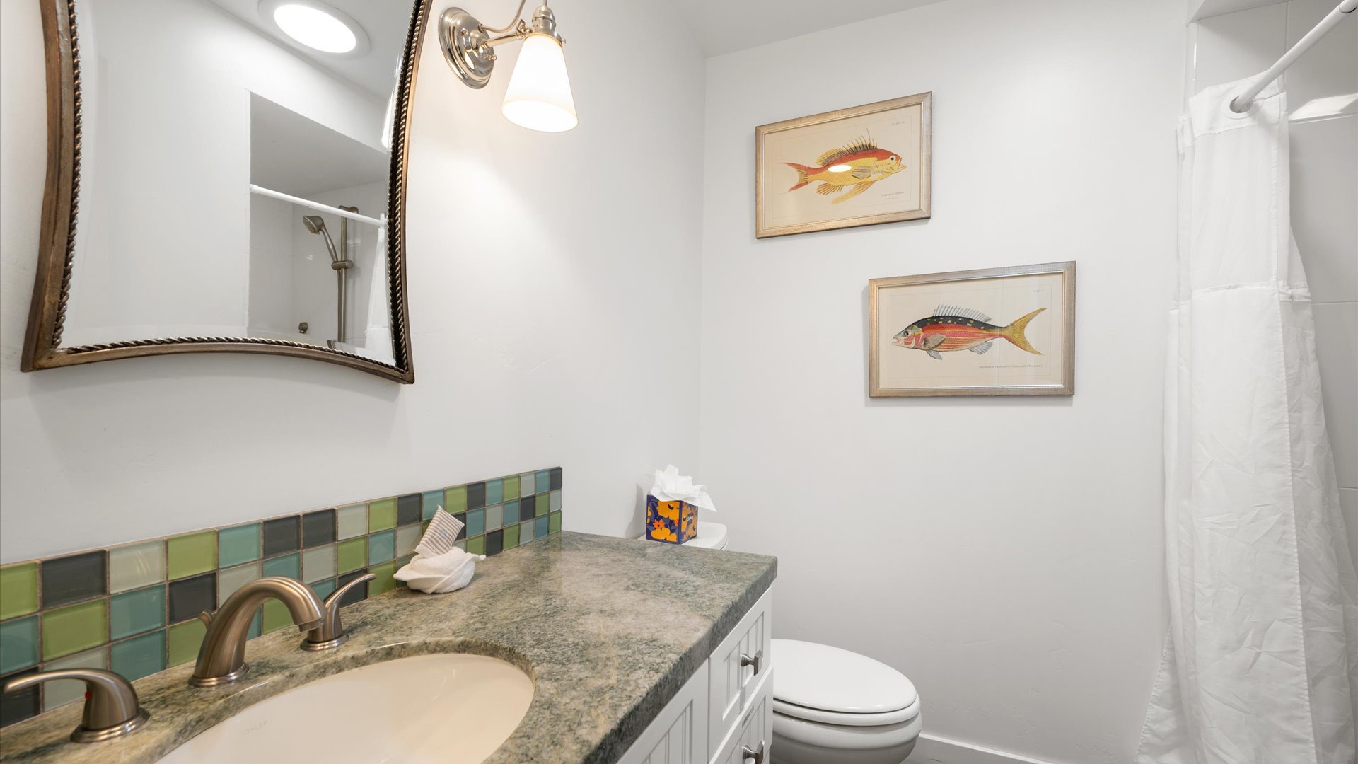 The full bathroom has a step-in shower.