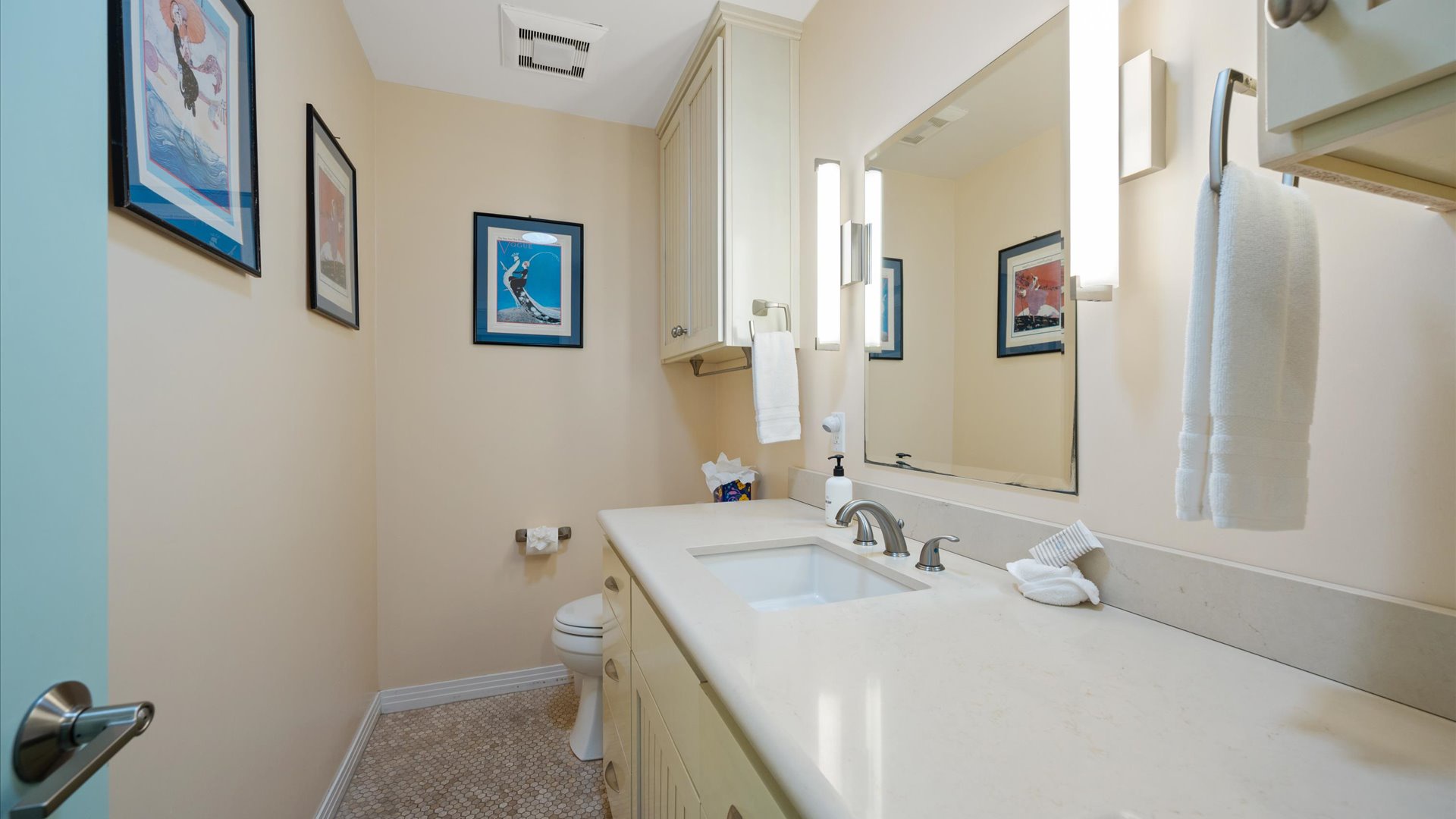 The half bath is easily accessible from the living room.