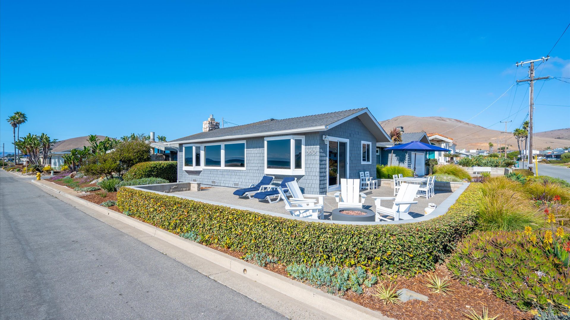 located on the corner lot, this home features multiple outdoor patios including the front ocean facing patio