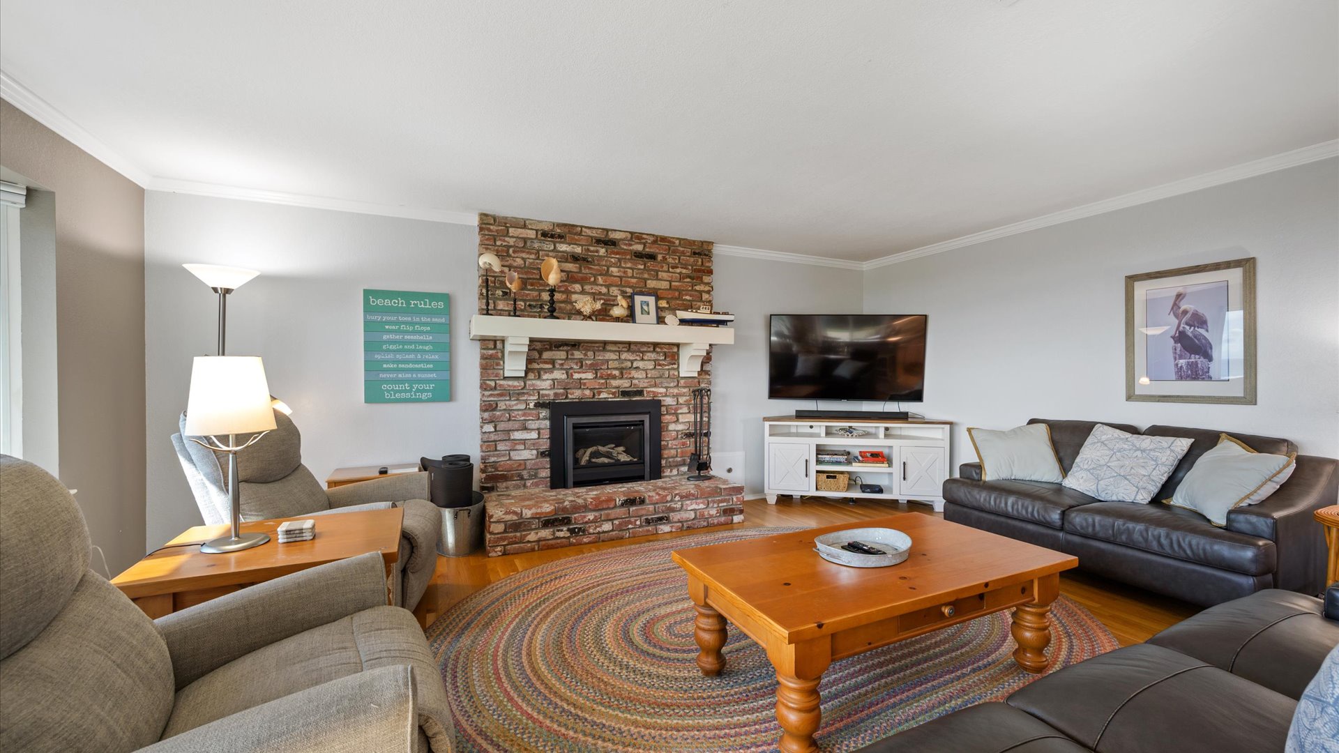 The living room features plenty of comfy seating for all