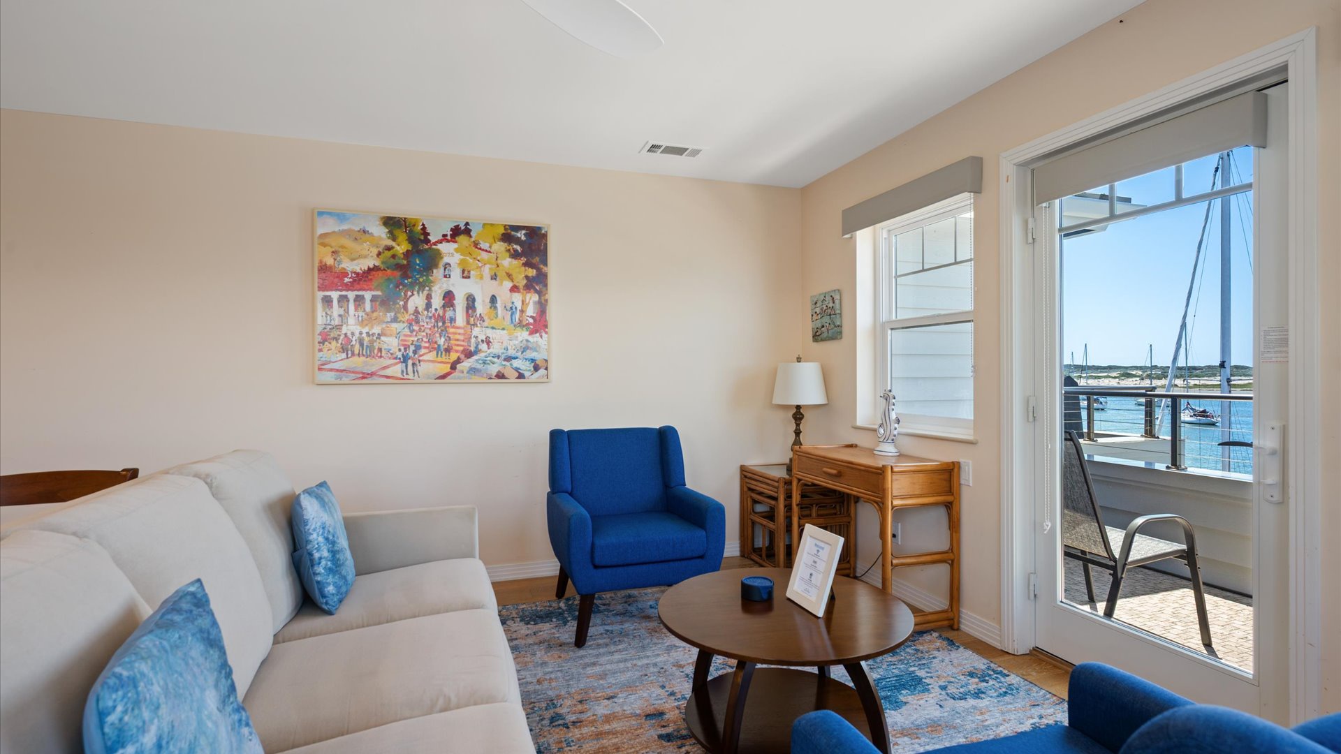 Living room features access to the balcony, flat screen tv, and fireplace