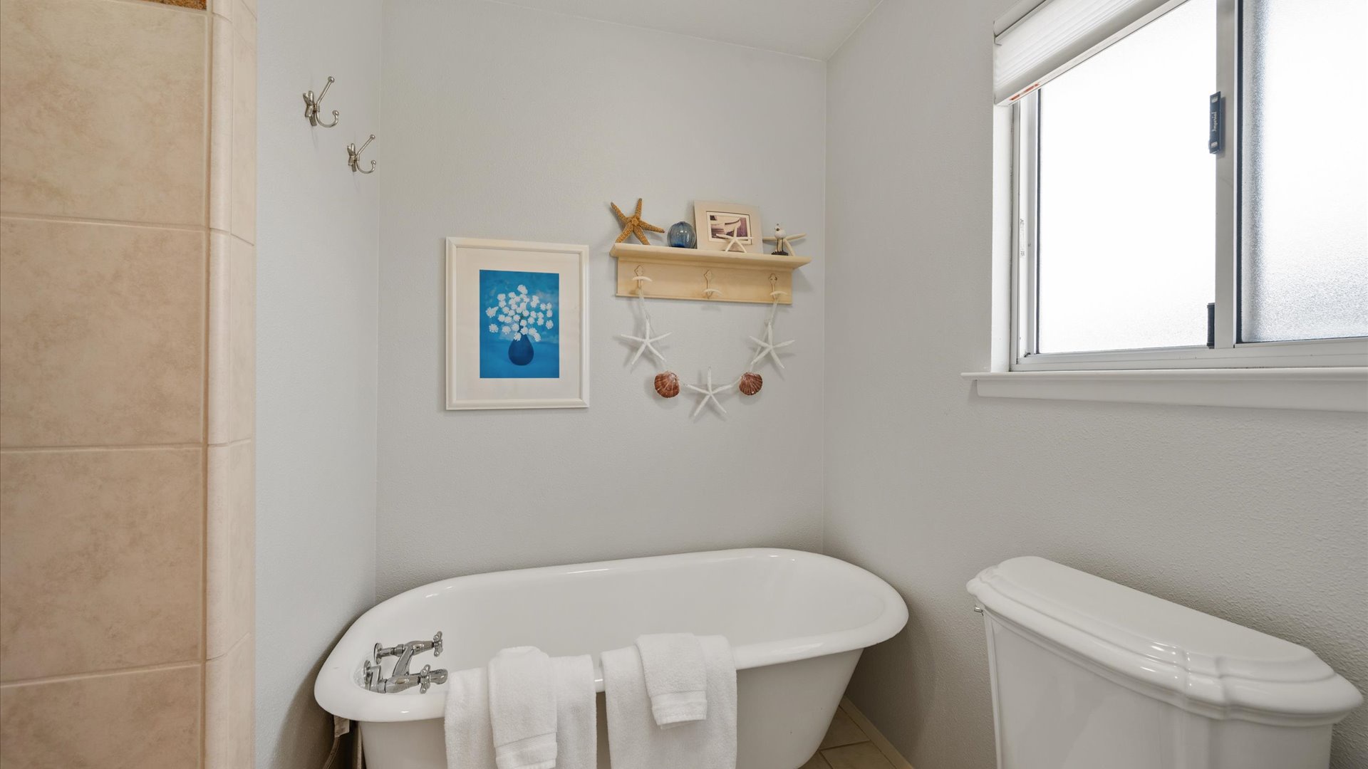 Master bath with a freestanding soaking tub