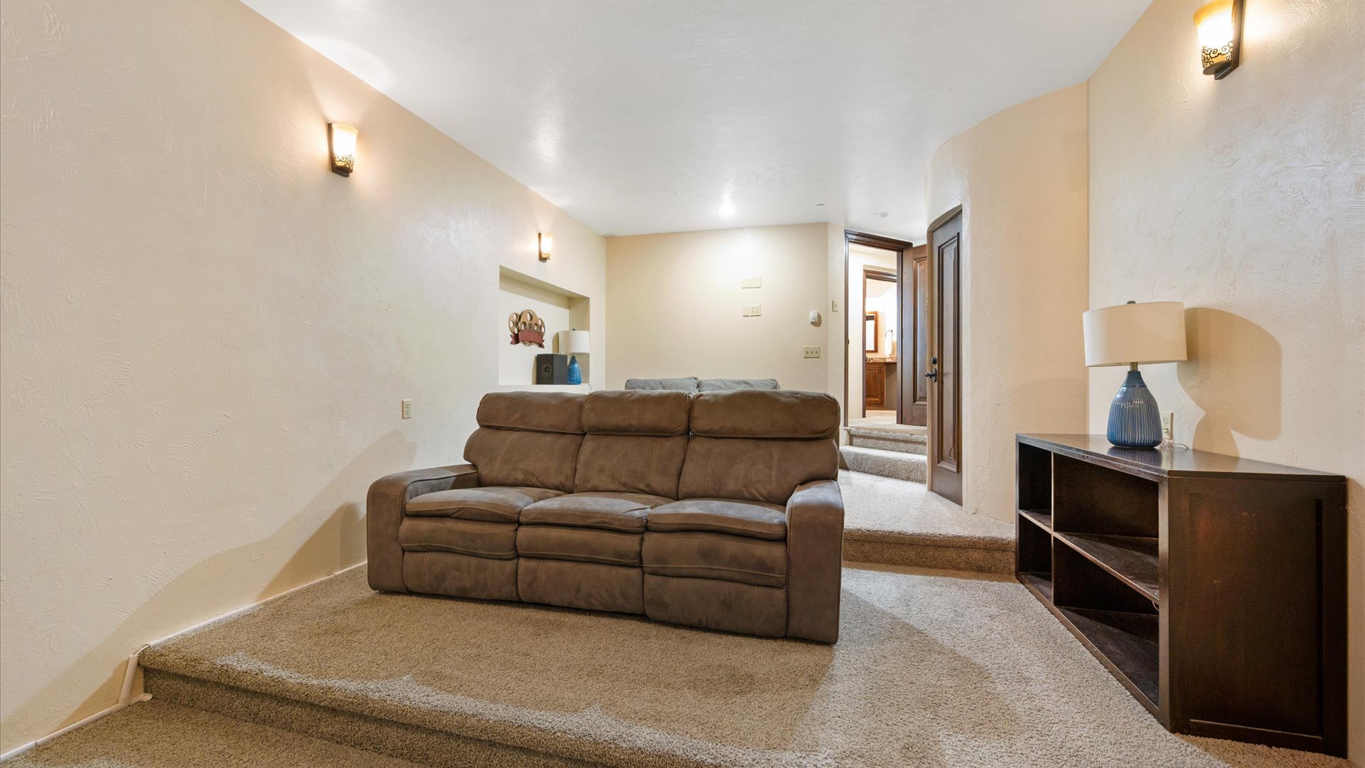 Sink into the plush reclining sofa, perfect for movie nights