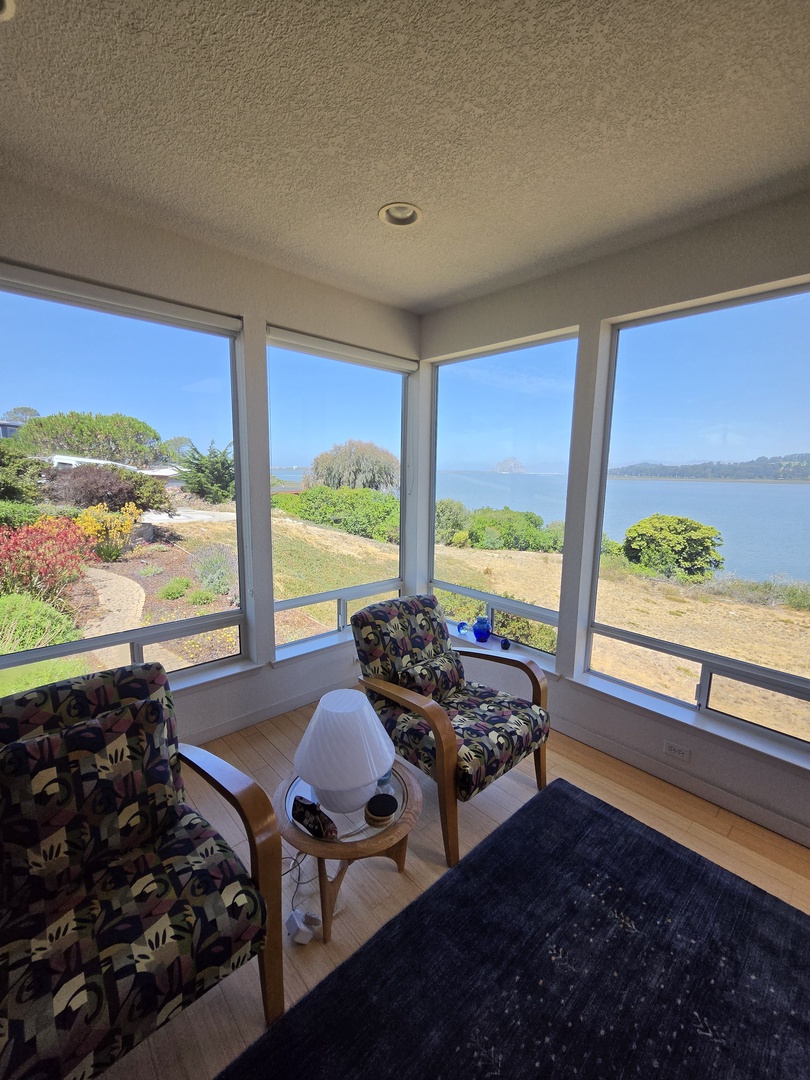 Panoramic windows frame the stunning views from the living room