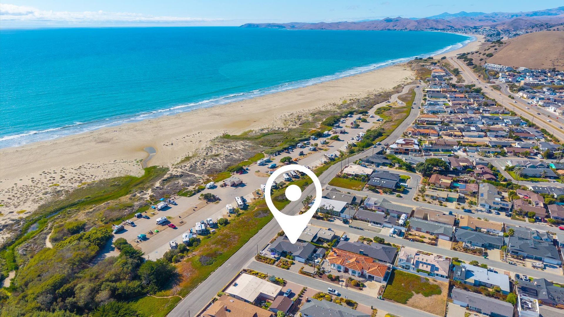 Arial view of the home, so close to the beach you will hear the waves crashing
