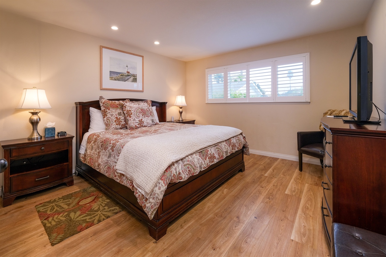The Master Bedroom is spacious with a king-size bed. a large flat-screen TV and a private bathroom.