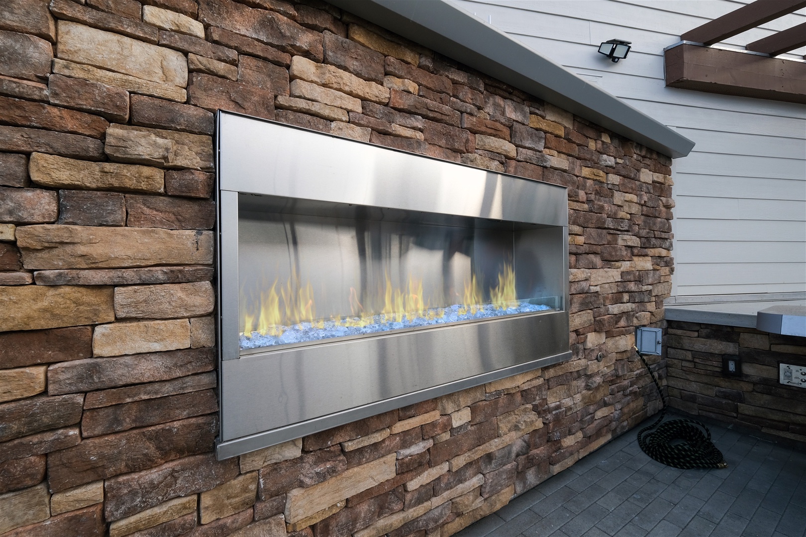 Outdoor fireplace for the perfect ambiance on coastal nights on the shared community patio