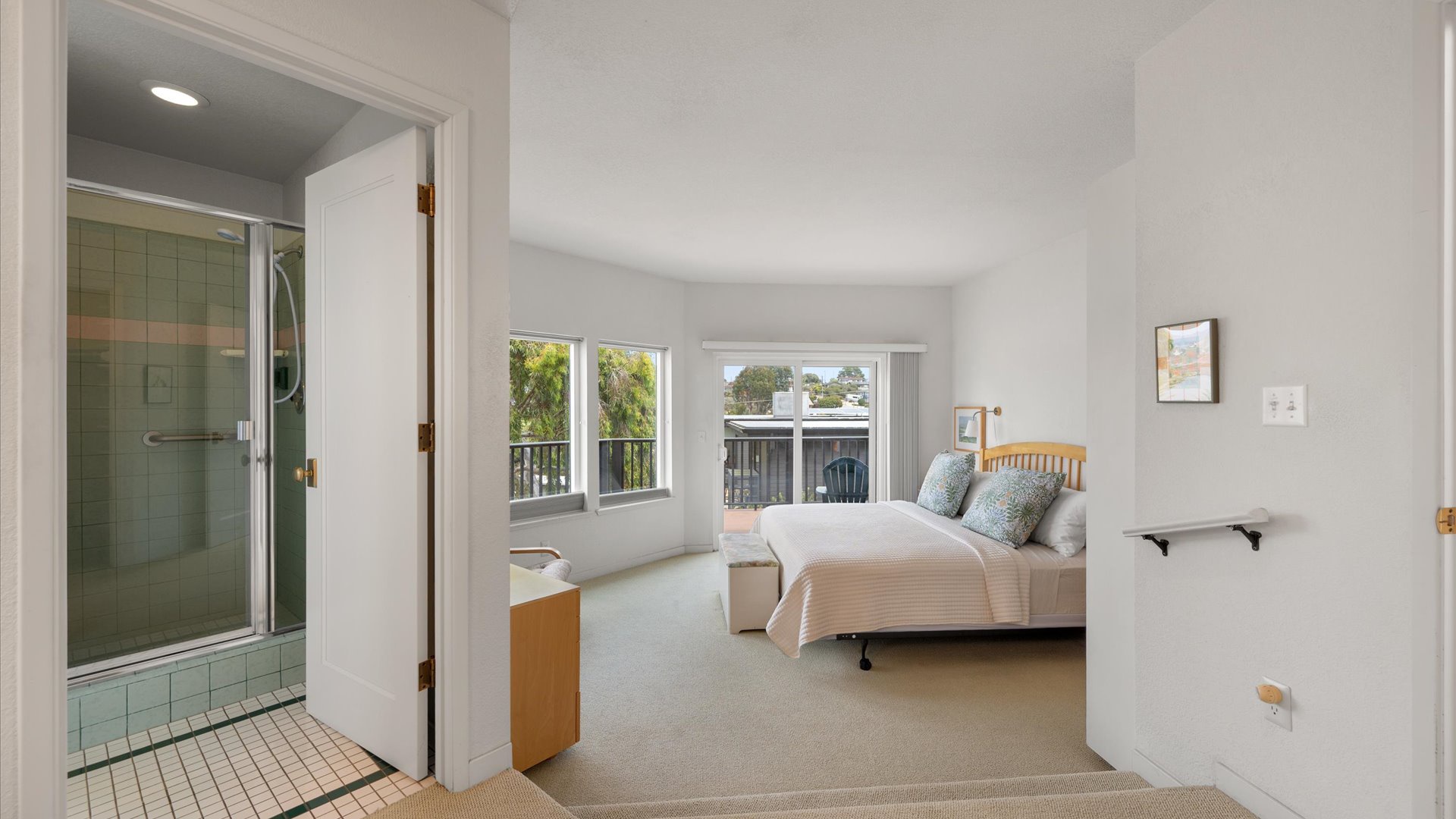 The primary suite offers ample space and ensuite bath