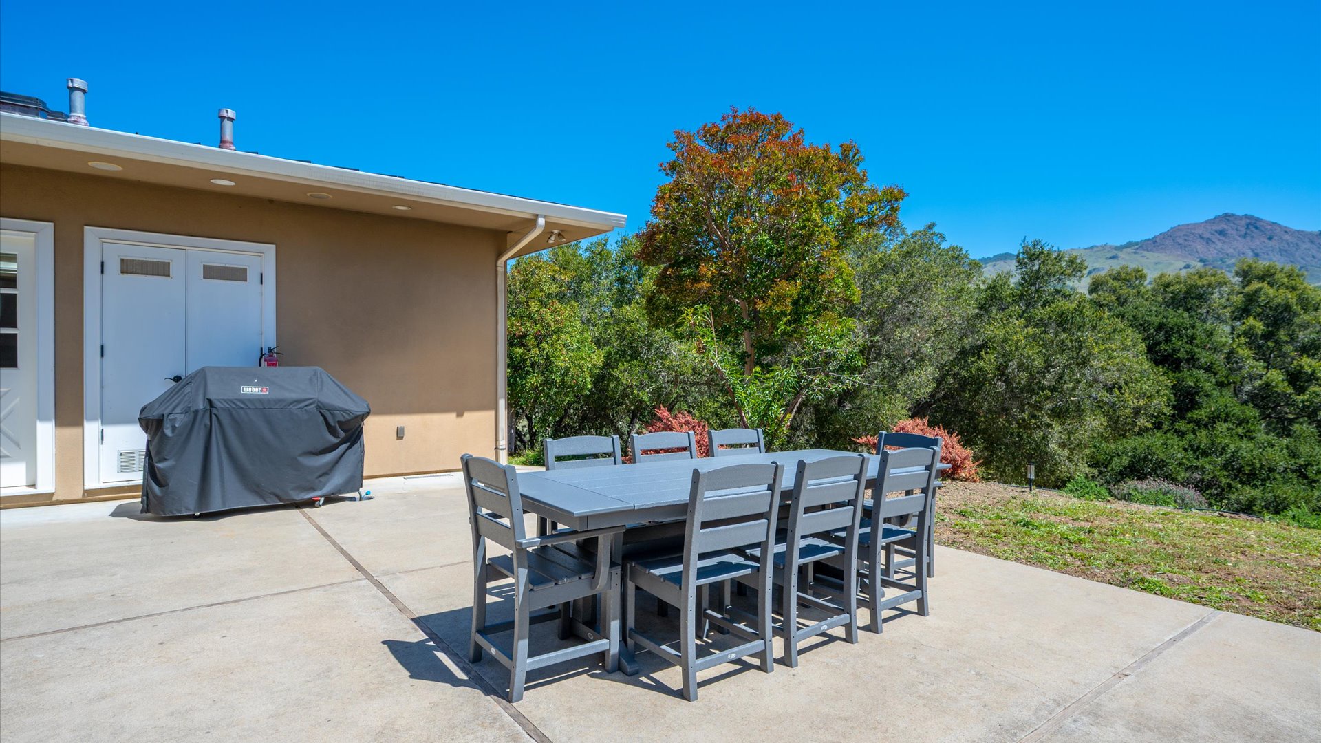 Outdoor dining area perfect for enjoying meals together with BBQ grill ready for your cookout adventures.