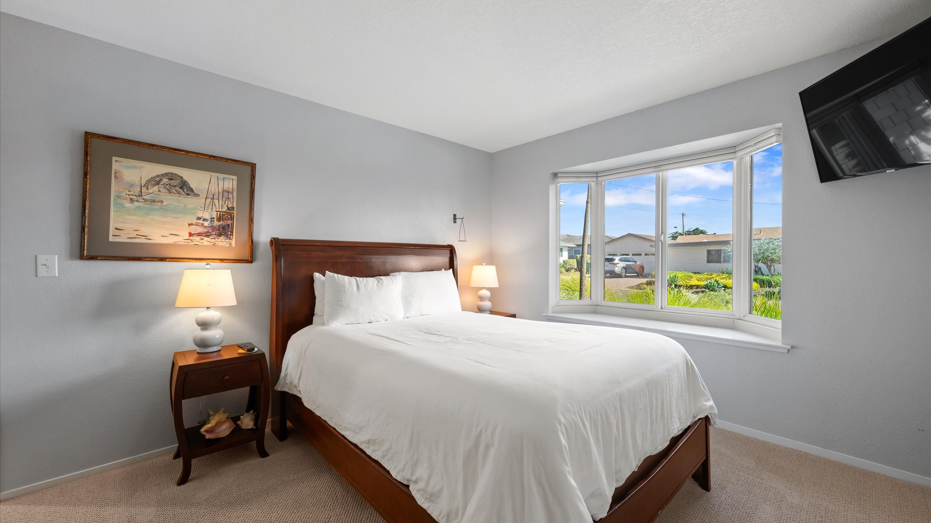 The second bedroom offers a queen sized bed with flat screen tv