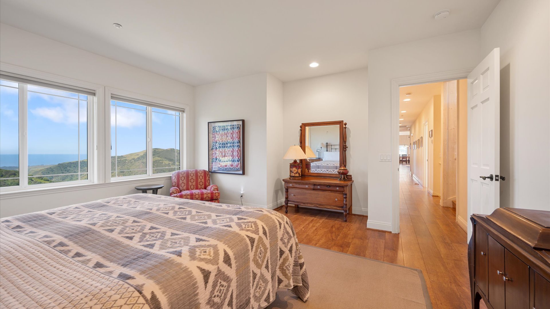 South primary bedroom features a king size bed with ensuite bathroom, additional twin size rollaway bed available in the closet