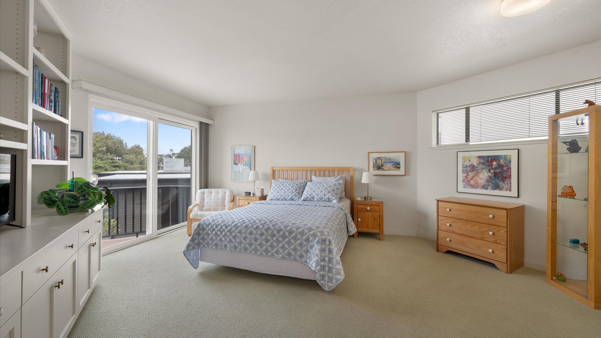 Second bedroom is spacious featuring a Queen-sized bed and access to the deck