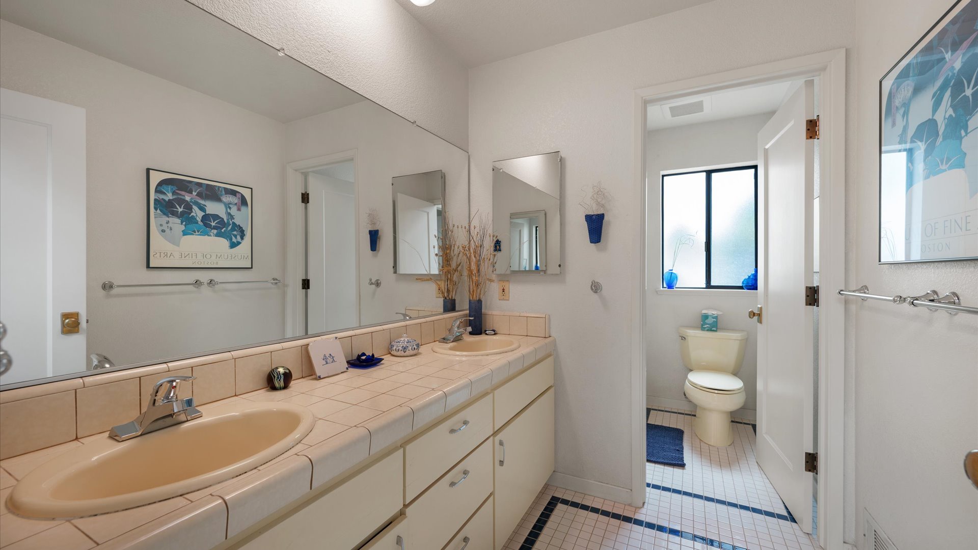 Hall Bath is shared between the second and third bedrooms with a combination shower/tub