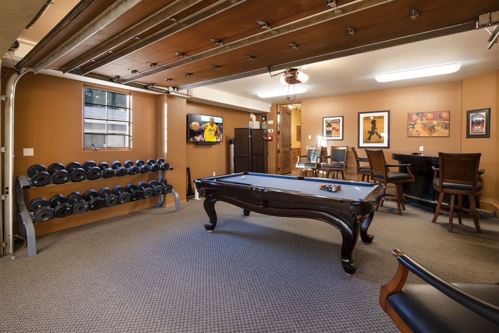 Game room also features additional seating NOTE: weight set has been removed