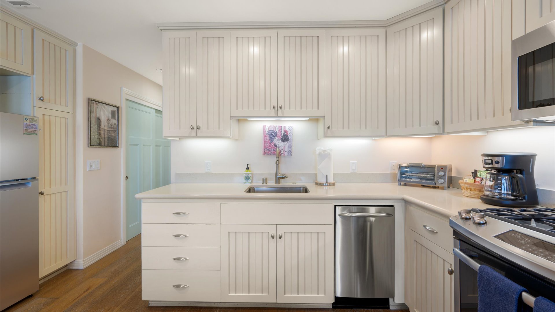 The kitchen has high-end appliances and everything you need to cook a nice meal.