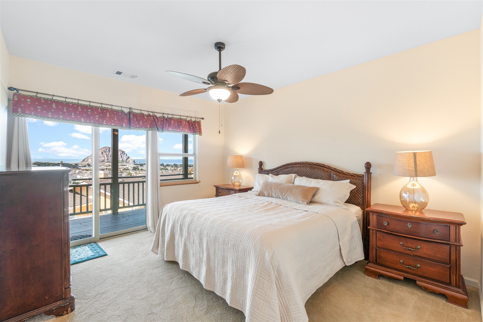 The fourth bedroom has a Queen bed with access to the lower level deck