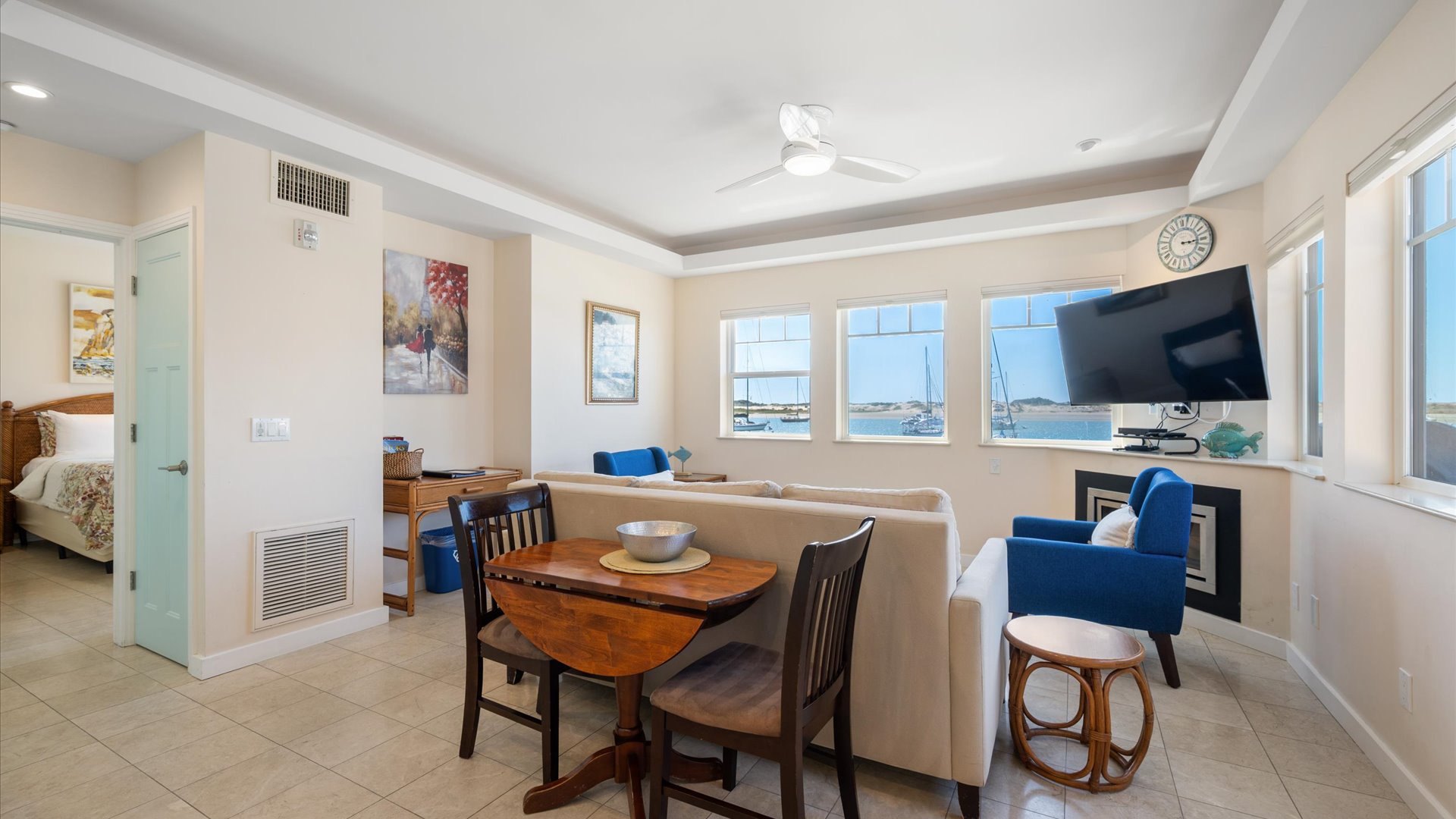 Dining area with seating between the kitchen and living space