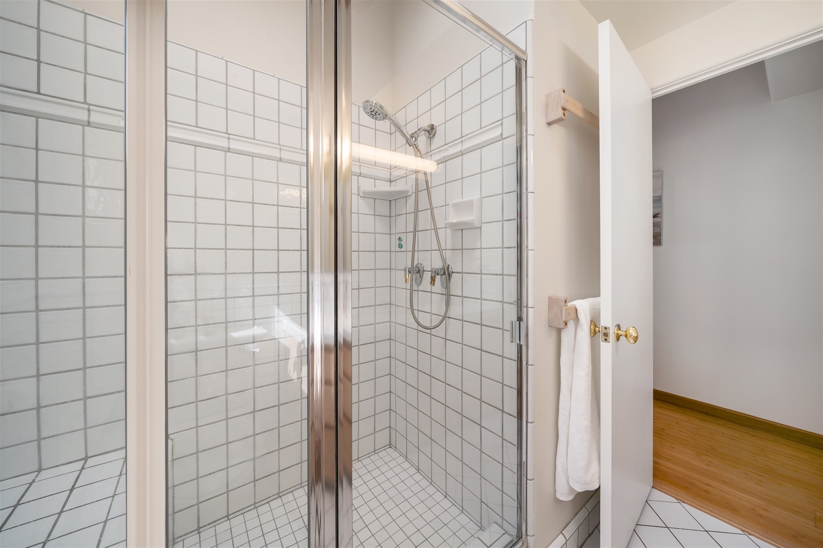 The downstairs bath also has a nicely tiled step in shower