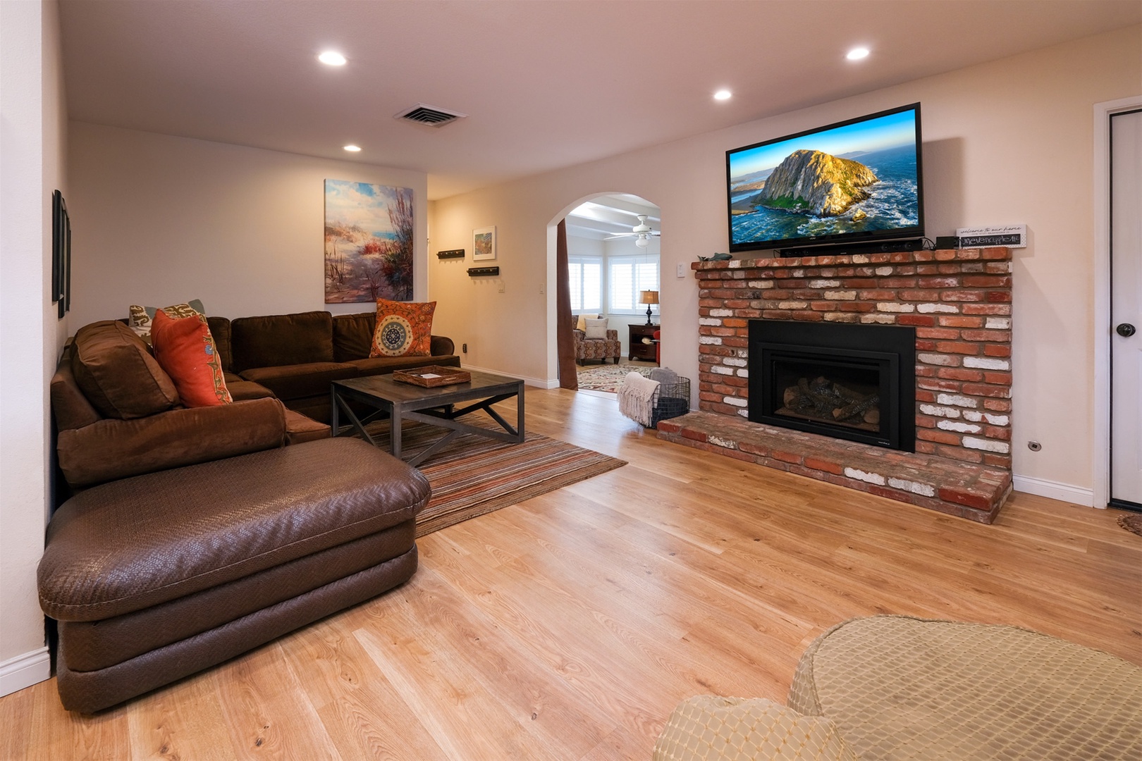 Den has a 60 inch TV, fireplace and Soundbar. 