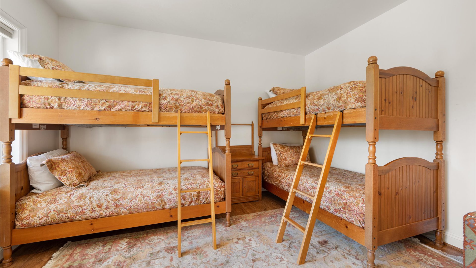 The fourth bedroom features 2 bunk beds for a total of 4 twin beds.