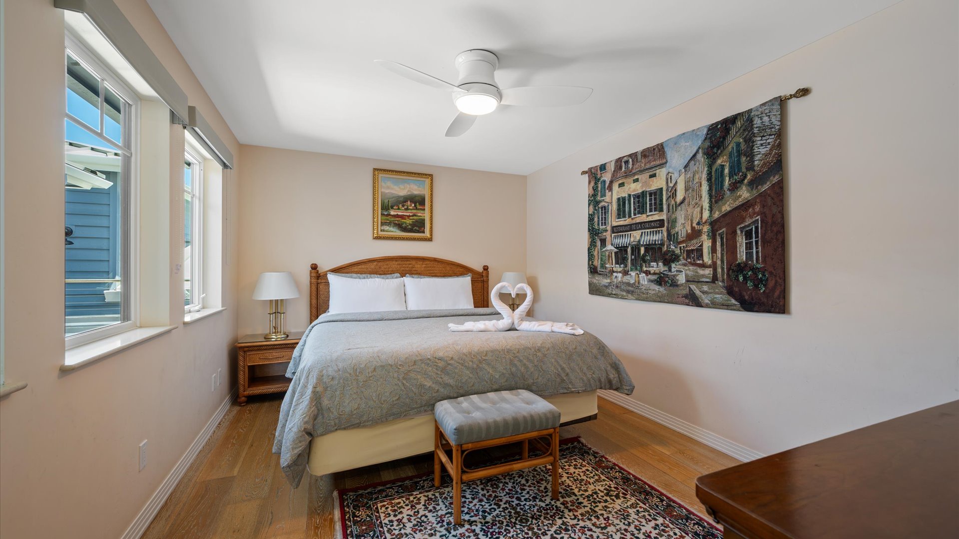 The bedroom has a king bed and TV.