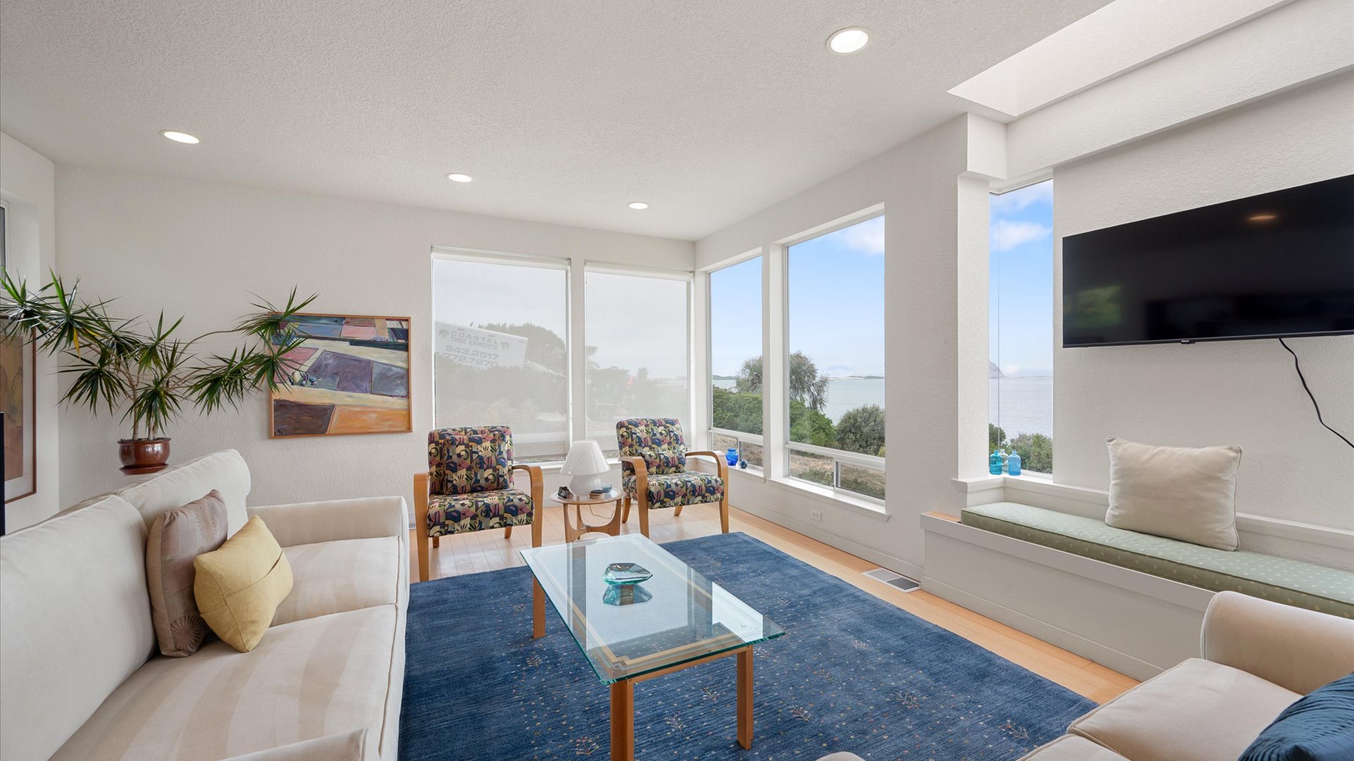 Panoramic windows frame the stunning views from the living room