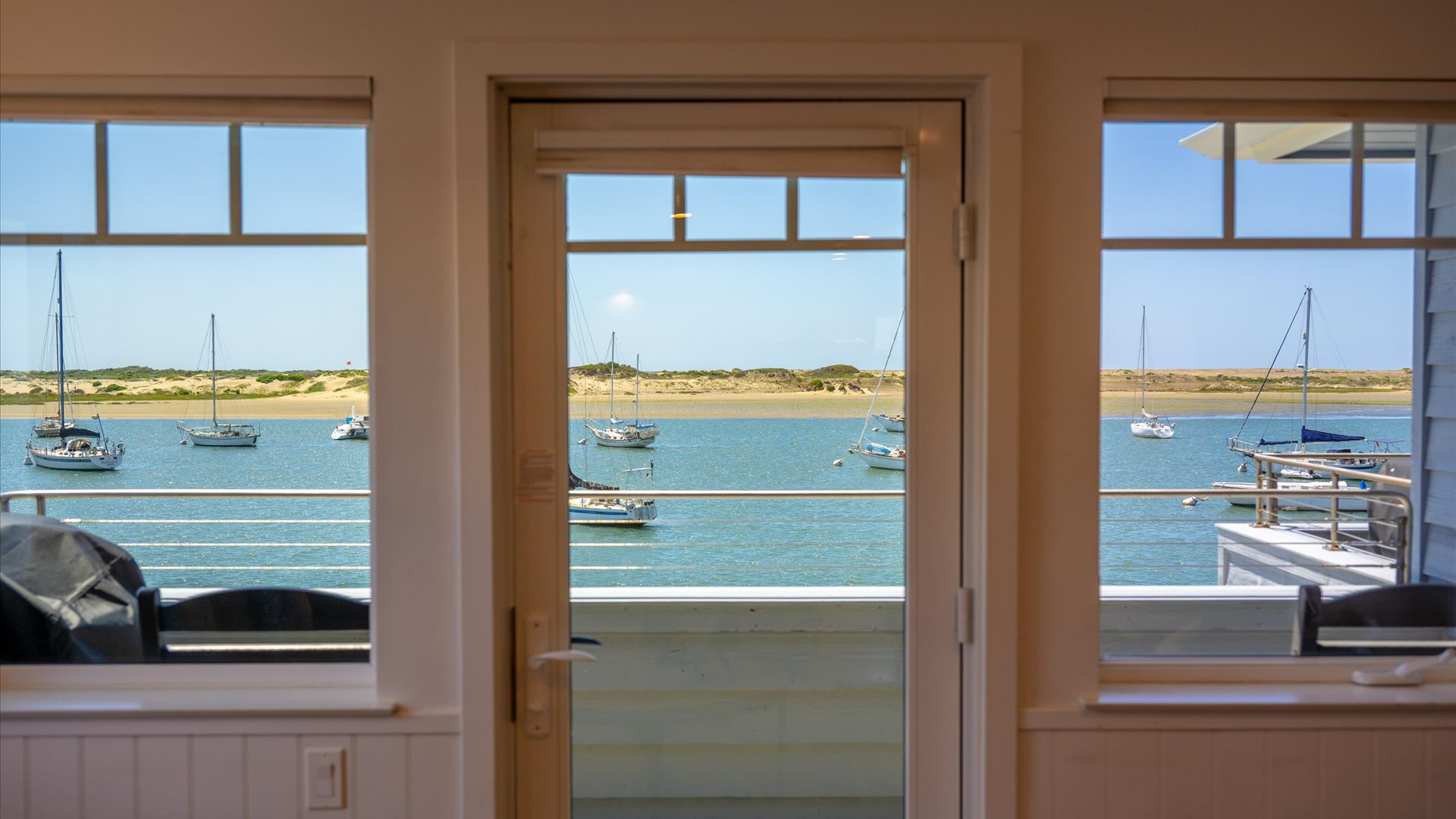 Step through these doors in the living room to your private bay front balcony