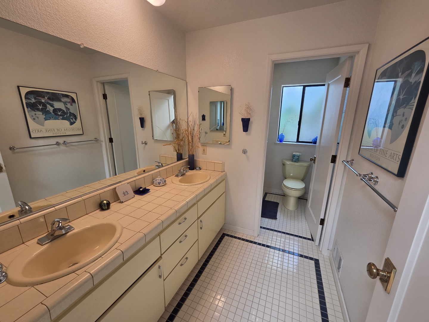 Hall Bath is shared between the second and third bedrooms with a combination shower/tub