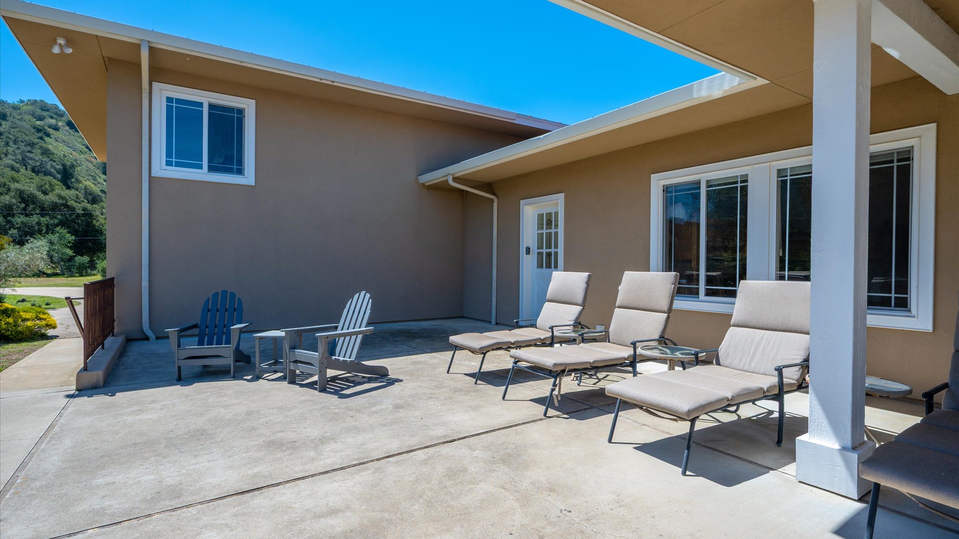 The back patio offers a partially covered area along with large space to gather and grill up a meal