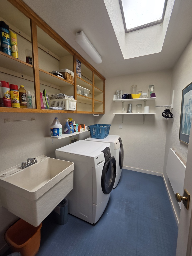 Laundry room with washer and dryer for guest use