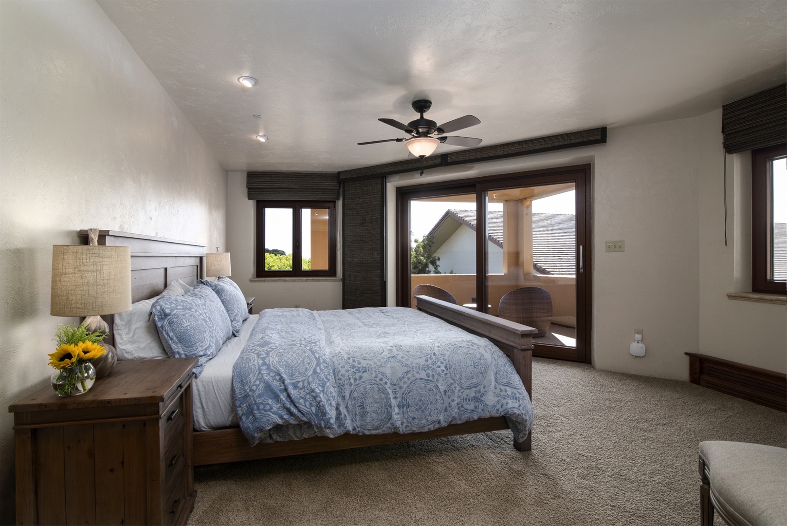 Carmel Suite features a Cal King size bed, and en suite full bathroom, wrap-around balcony access with some limited ocean views and a flat screen TV with a Roku
