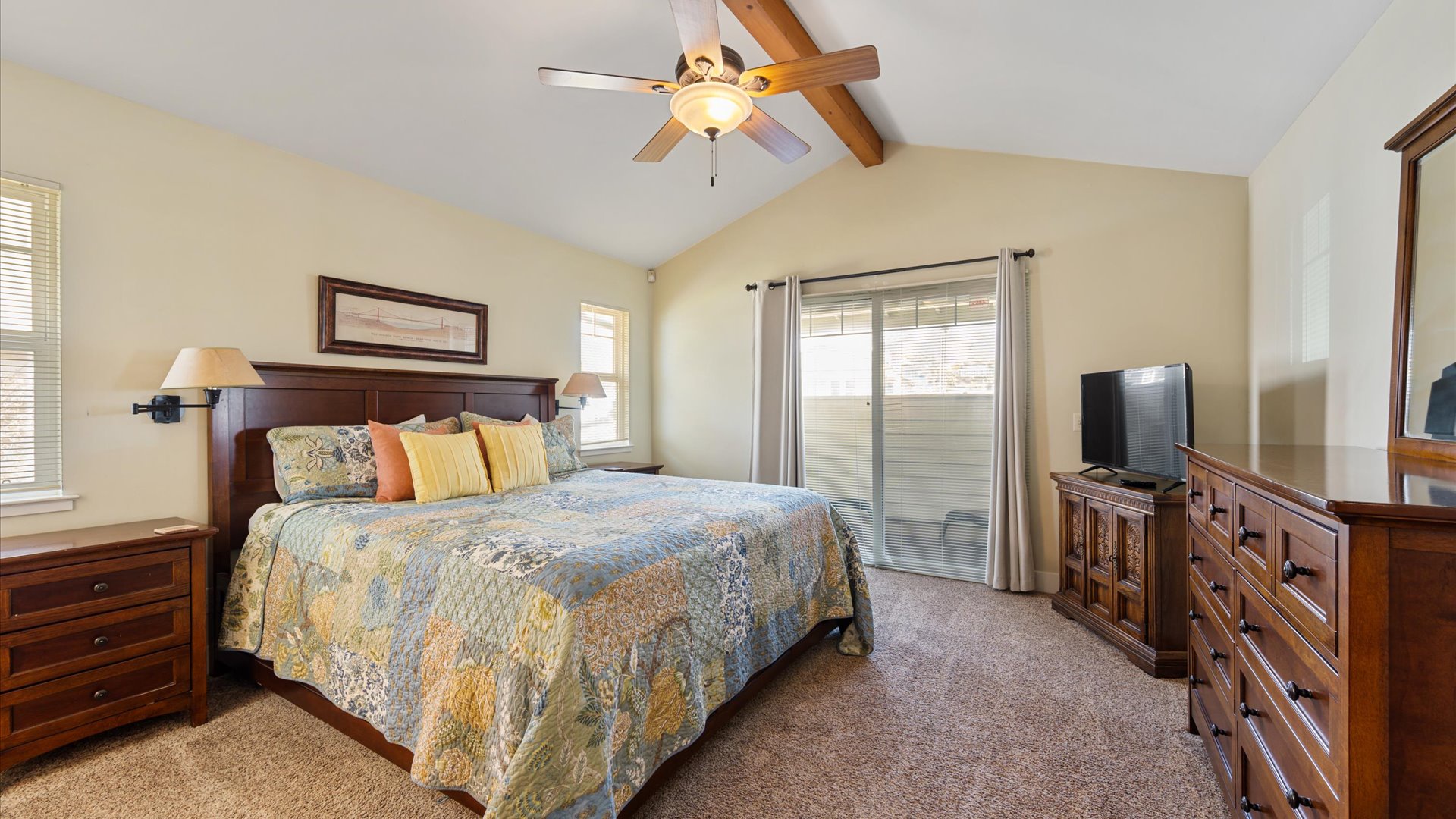 This spacious master bedroom has its own private patio, a TV and a private bathroom with shower.