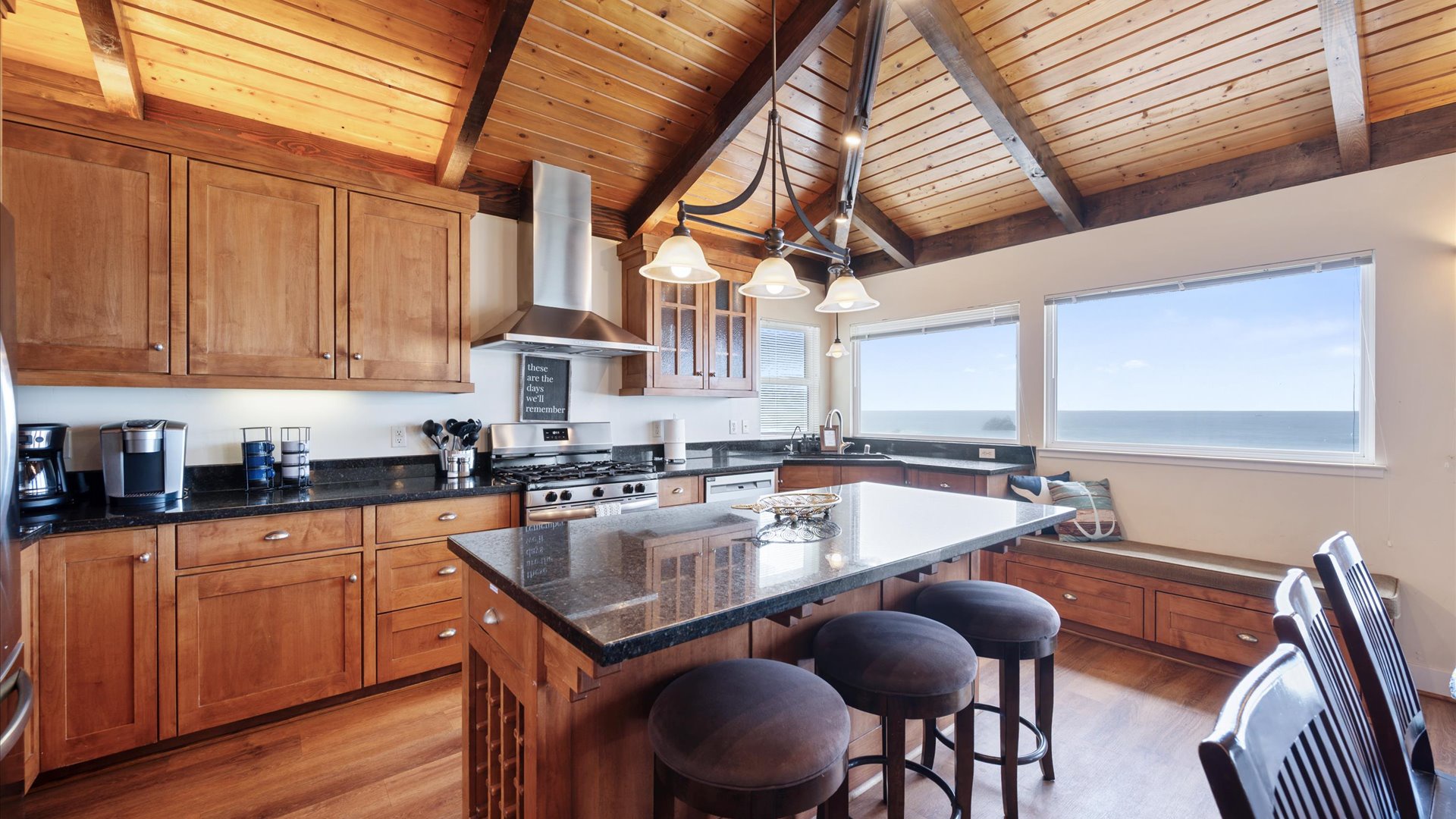 Enjoy bar stools at the kitchen counter while watching the master chef prepare dinner