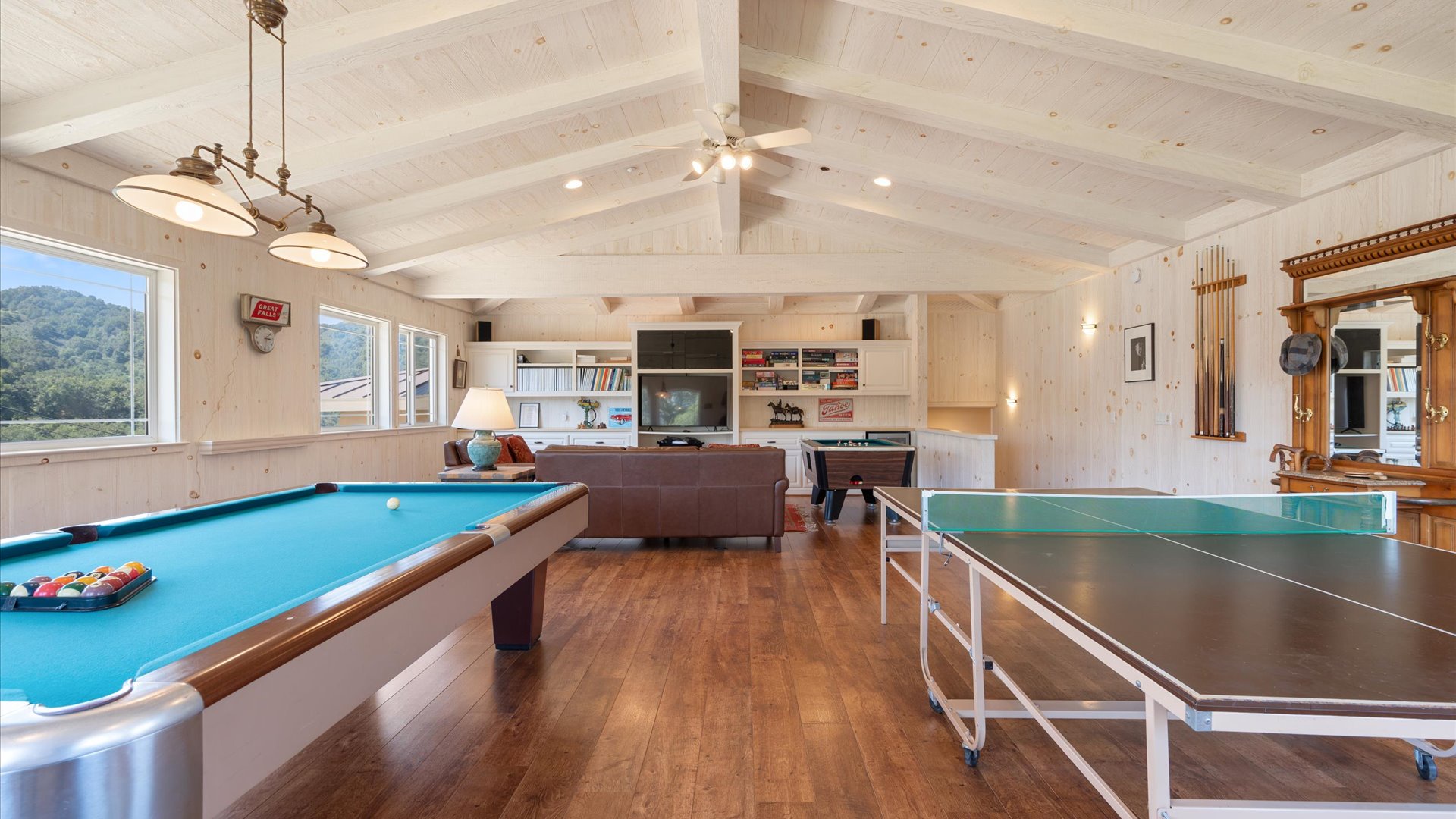 Game Room complete with ping ping, bumper pool, and traditional pool table. Plus large flat screen tv and comfy seating!