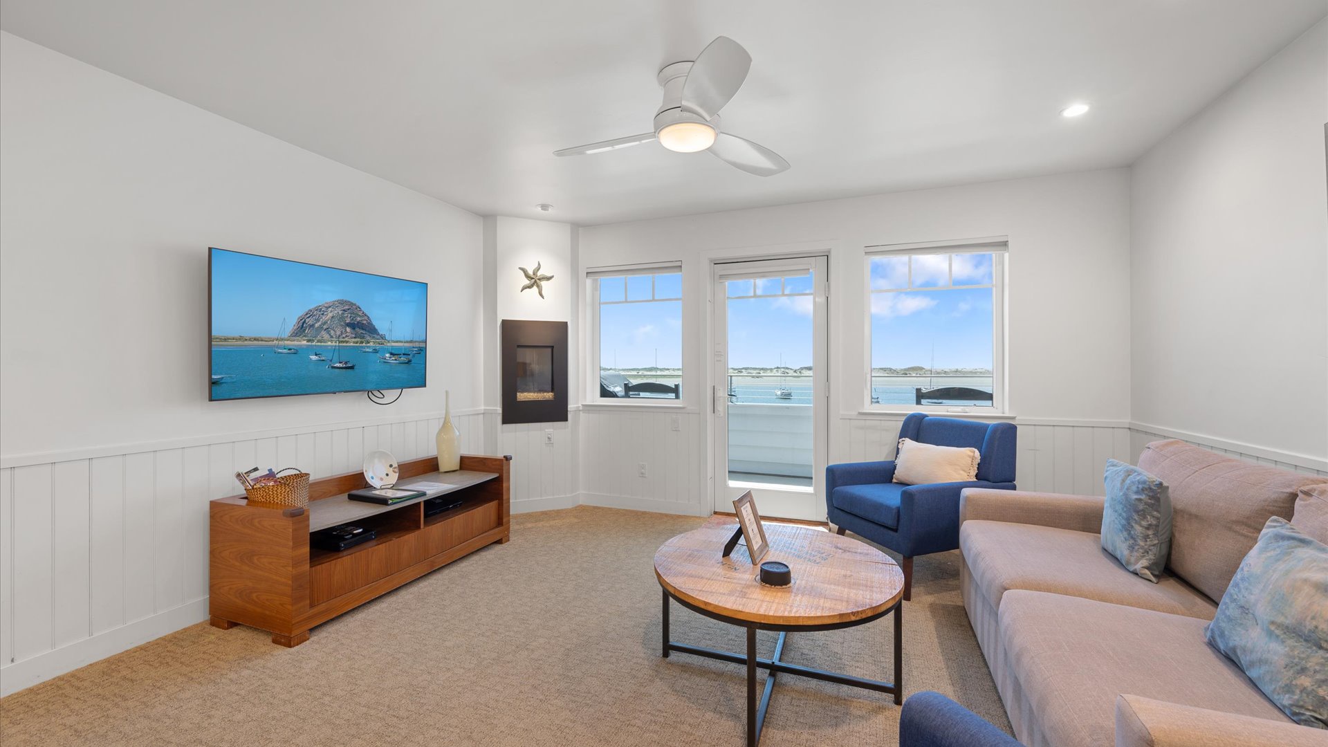 The spacious living room has wonderful views and comfortable seating