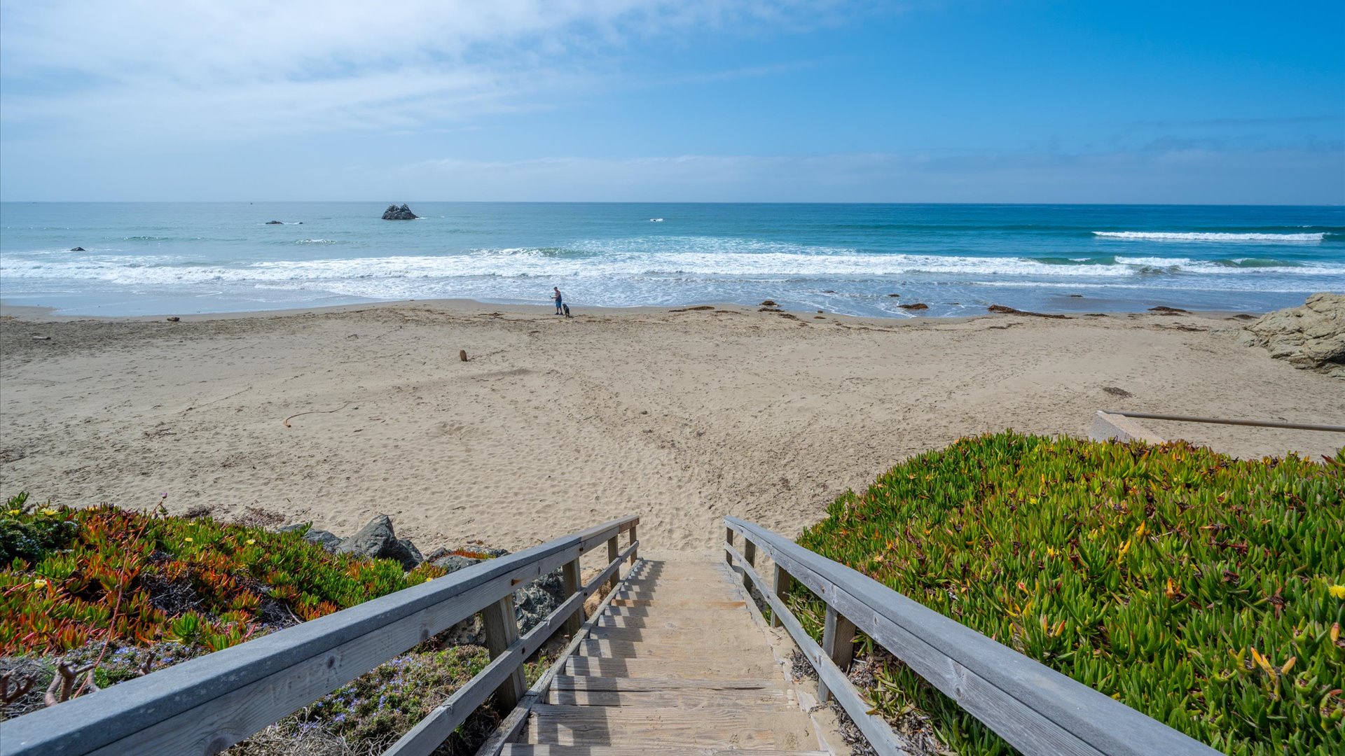 The beach is calling....these stairs to the sand are right outside your front door
