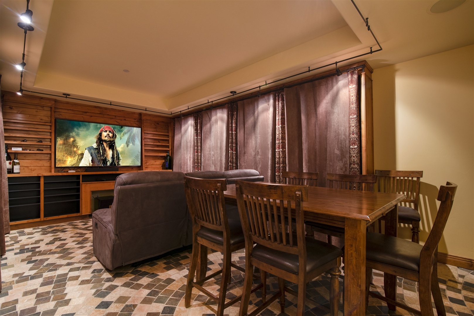 Downstairs you will find a theater room with comfy seating and high top table, perfect for entertaining or watching a movie.