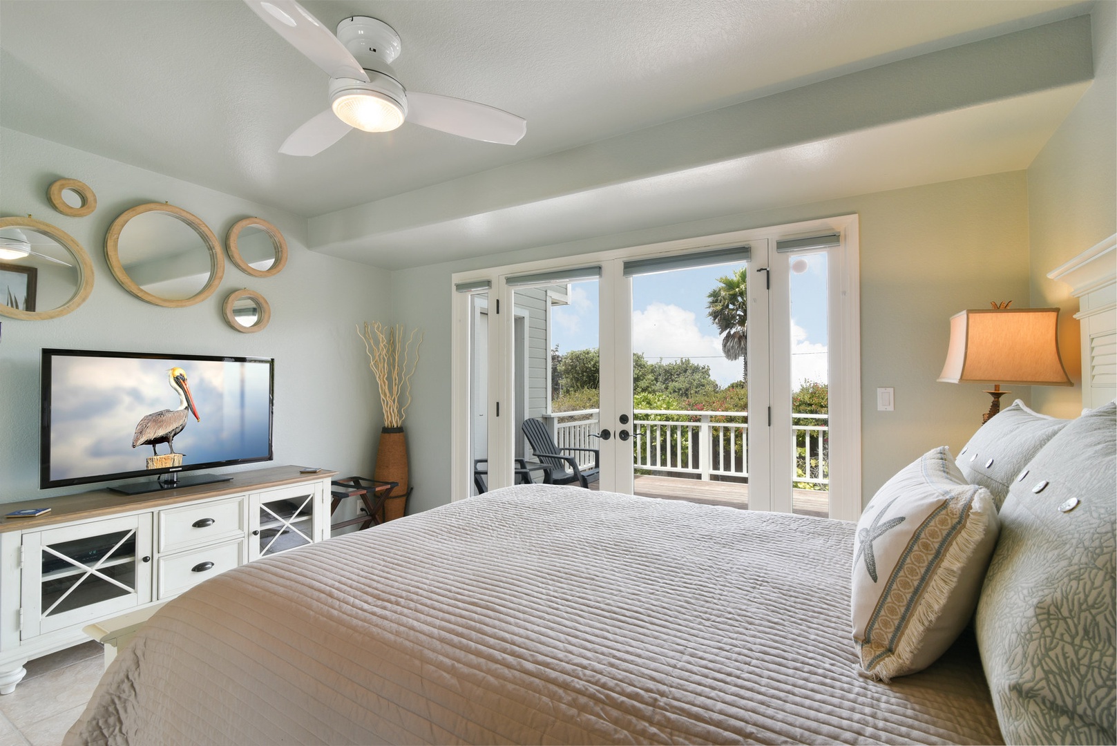 The downstairs den/3rd bedroom has direct access to the bottom deck and backyard