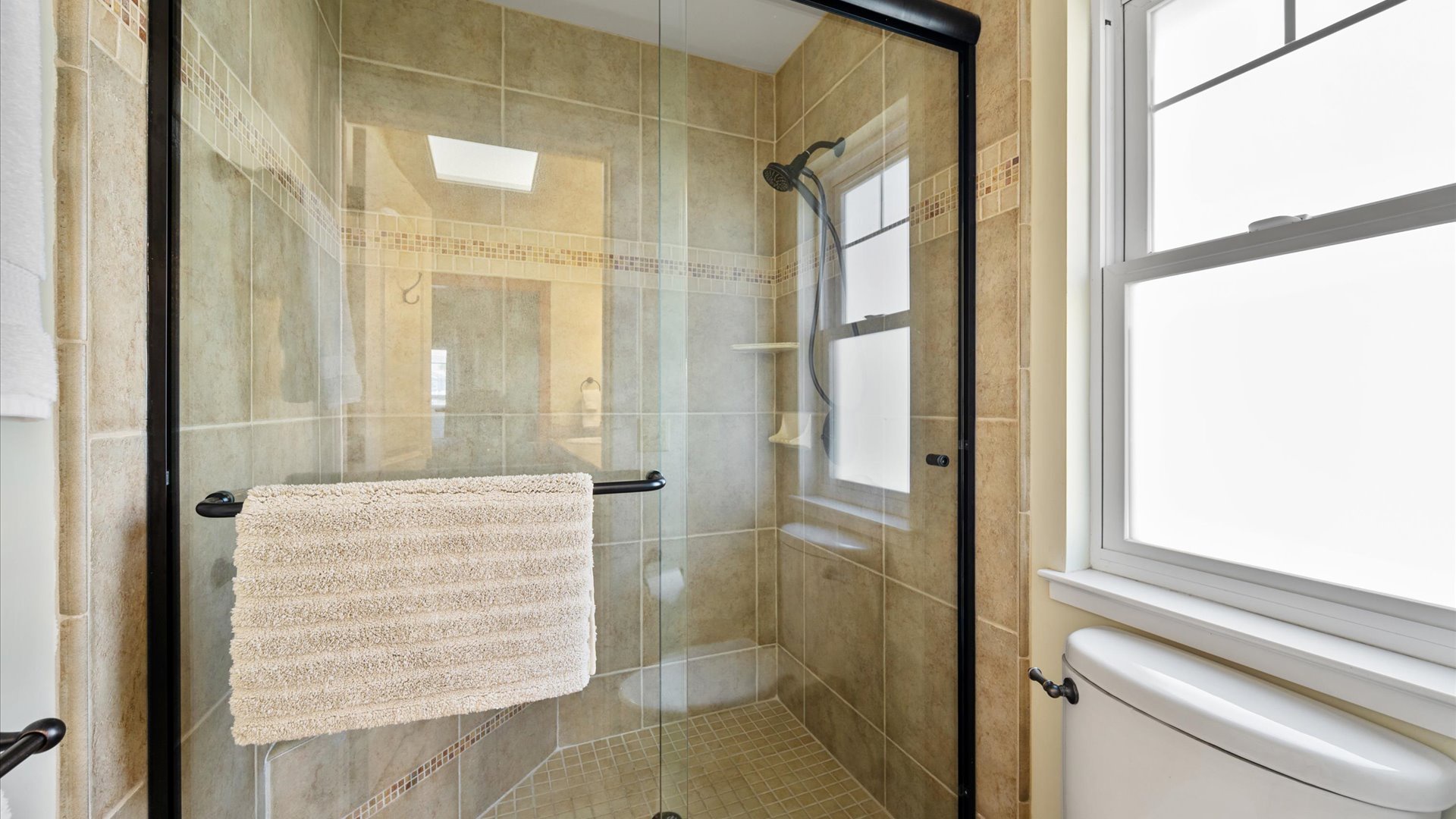 Very spacious master with beautifully tiled walk-in shower