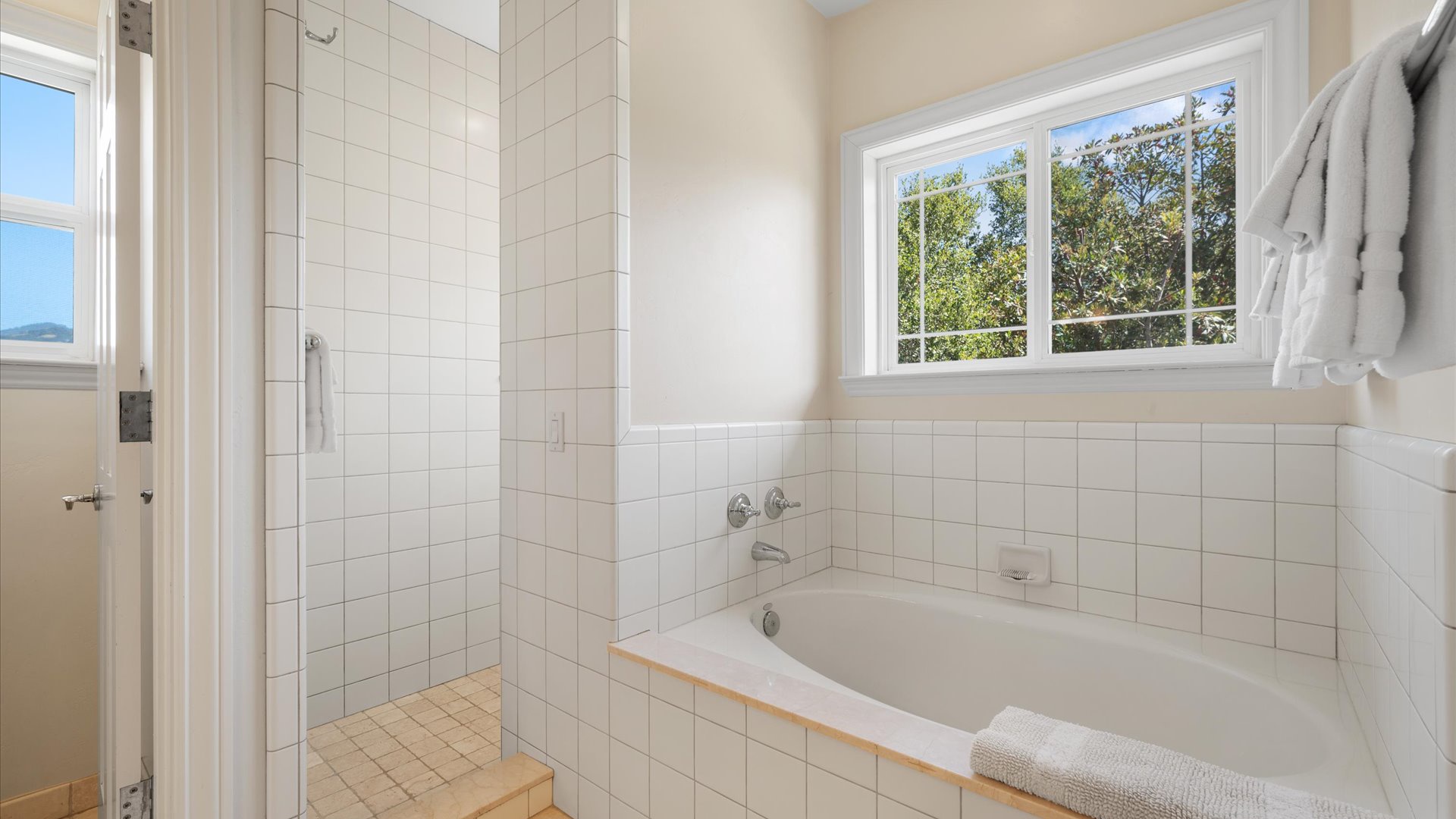 Refresh in your private bathroom with a soaking tub and separate walk-in shower