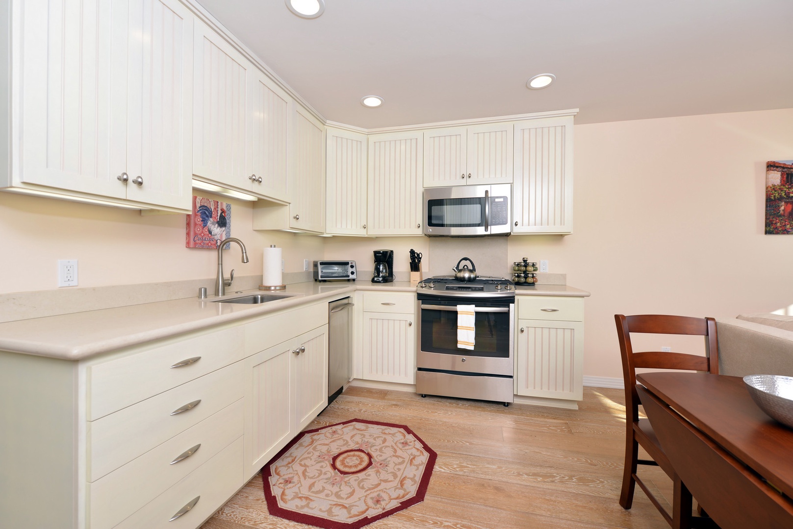 The kitchen has high-end appliances and everything you need to cook a nice meal.