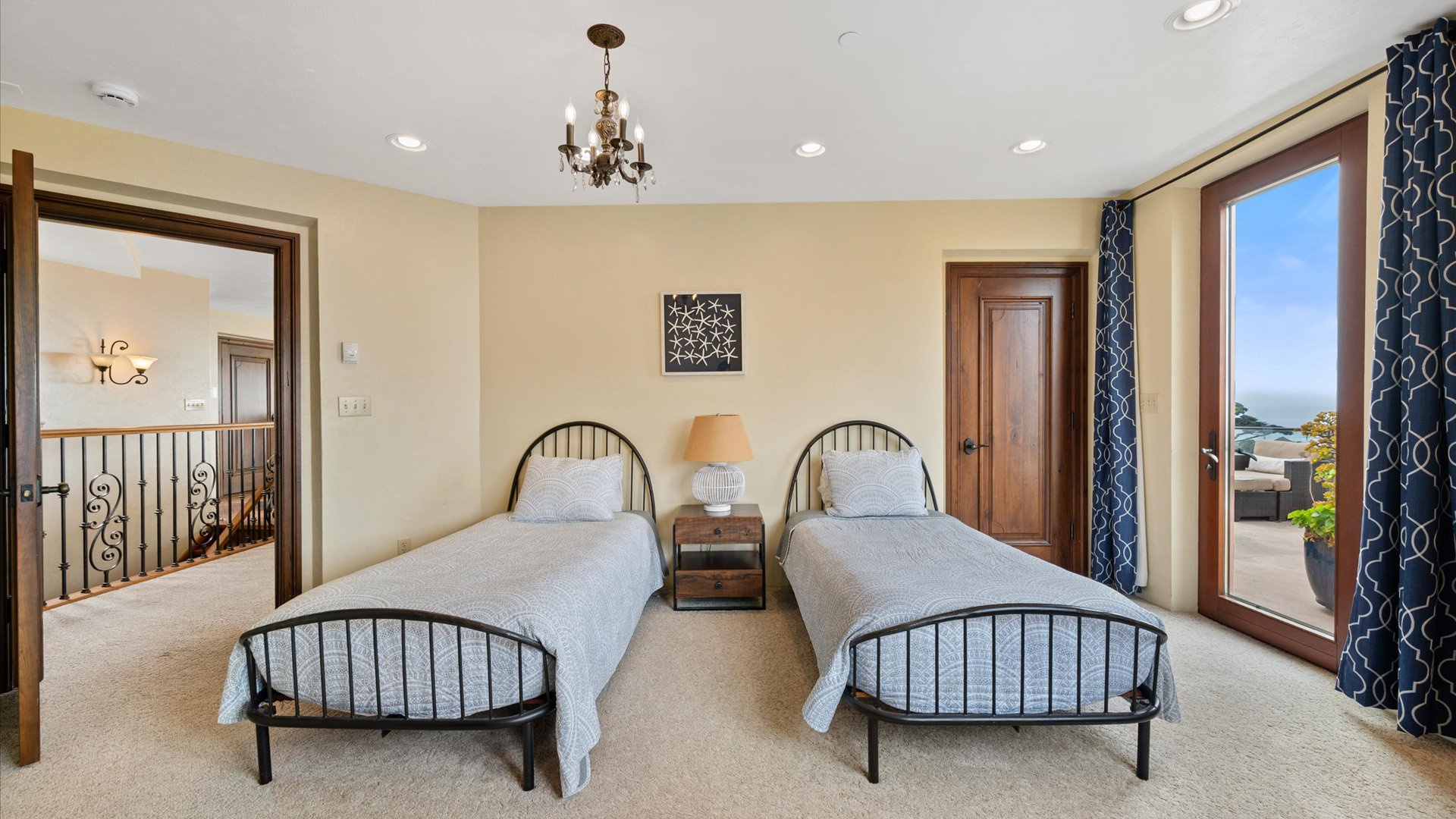 Santa Cruz Suite features 2 twins beds wrap-around balcony access and has an attached Jack-and-Jill bathroom