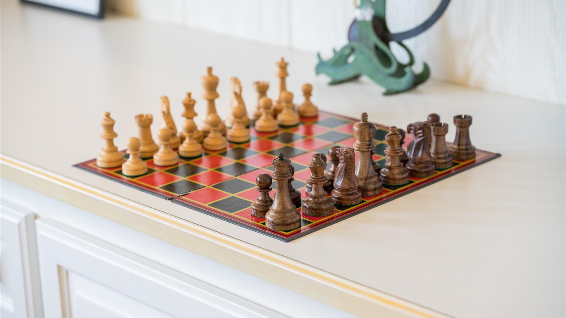 Challenge yourself to a friendly game of chess on a beautifully crafted wooden board, ready for your next strategic move