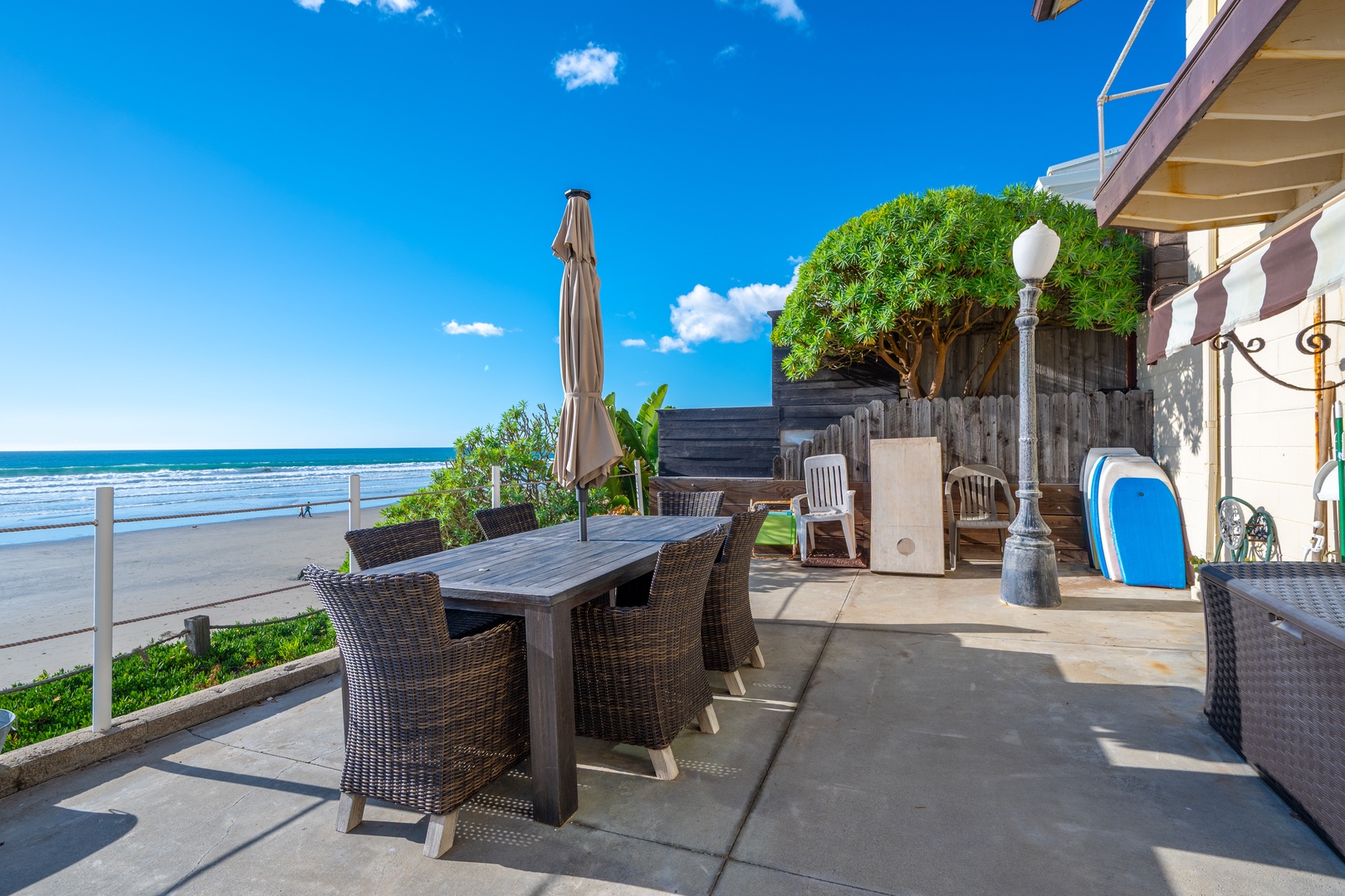 Oceanfront patio offers outdoor dining set, dine alfresco with unbeatable sunset views