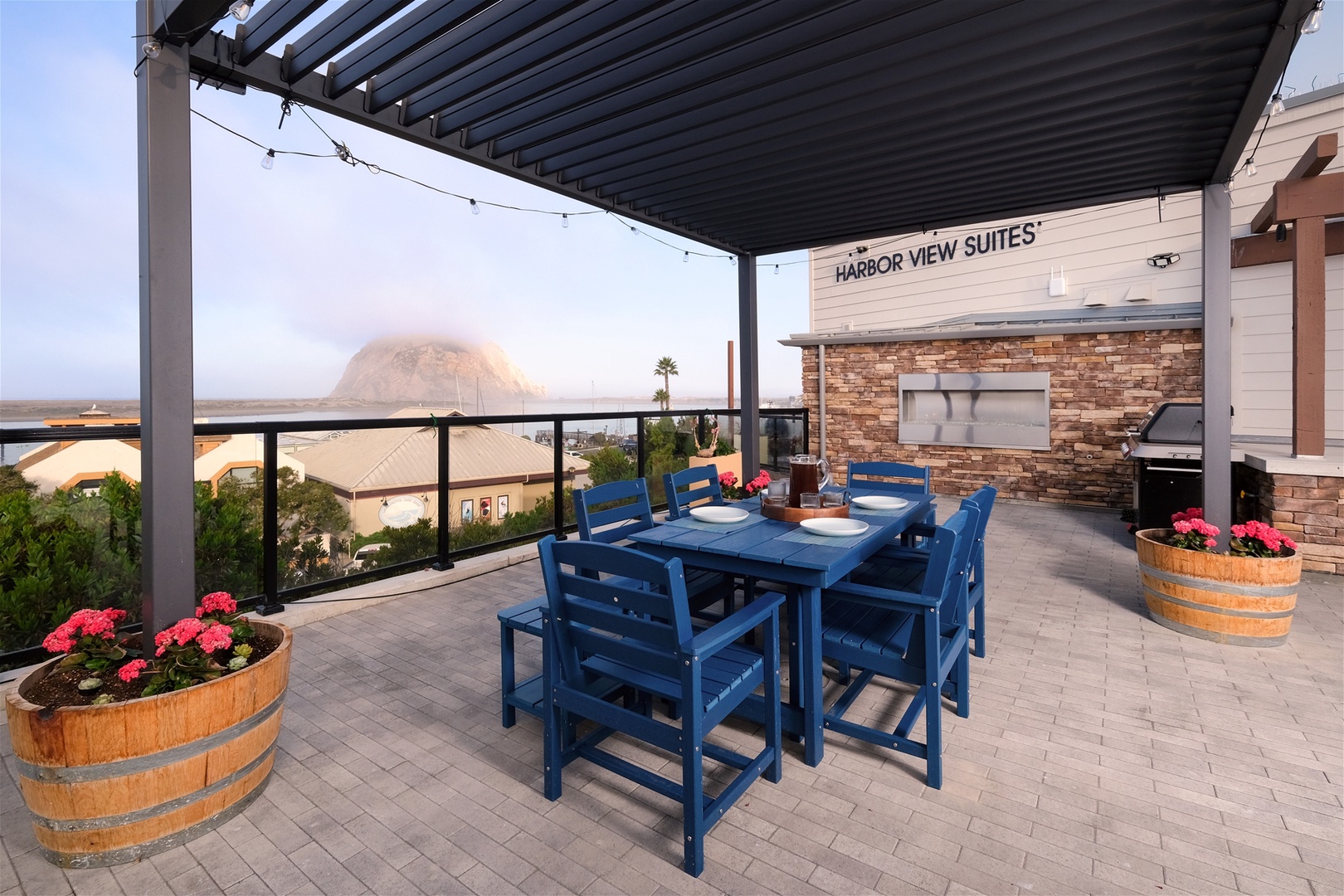 Gather around the outdoor dining table for al fresco meals with stunning views of the harbor