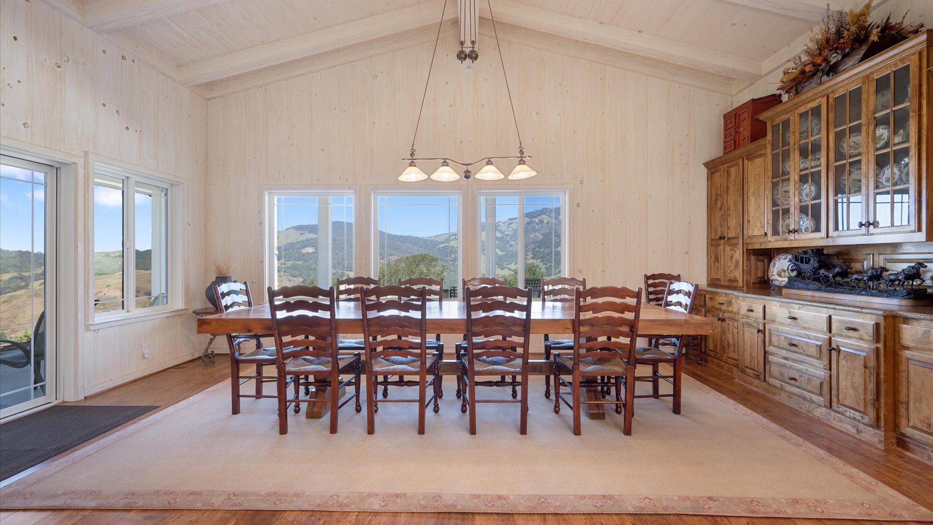 Gather around this formal dining table with enough seating for the whole group