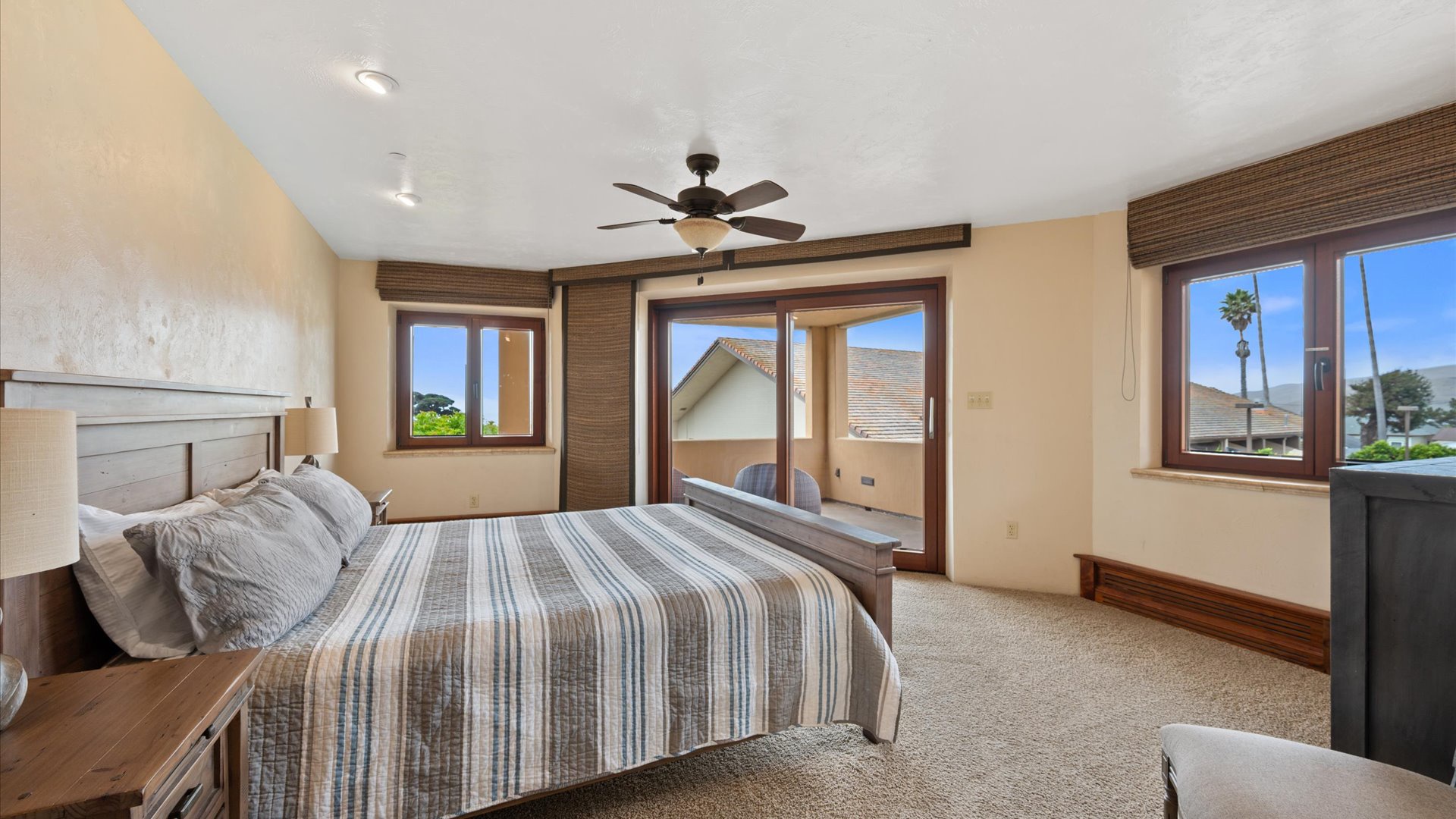 Carmel Suite features a Cal King size bed, and en suite full bathroom, wrap-around balcony access with some limited ocean views and a flat screen TV with a Roku